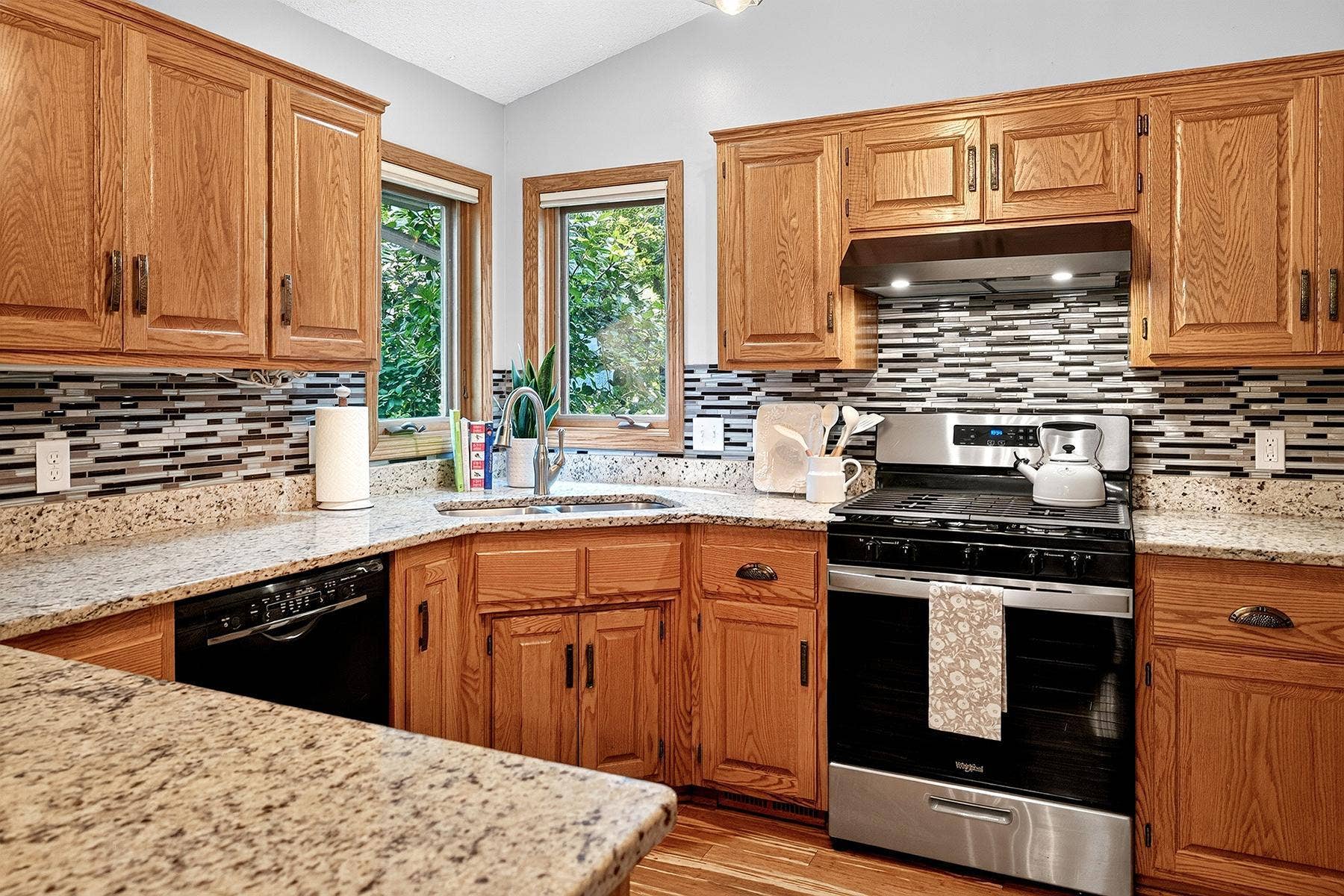 570 Dorland Road S, Maplewood, MN 55119 Granite countertops, natural wood cabinets and stainless steel stove and refrigerator new in 2025.