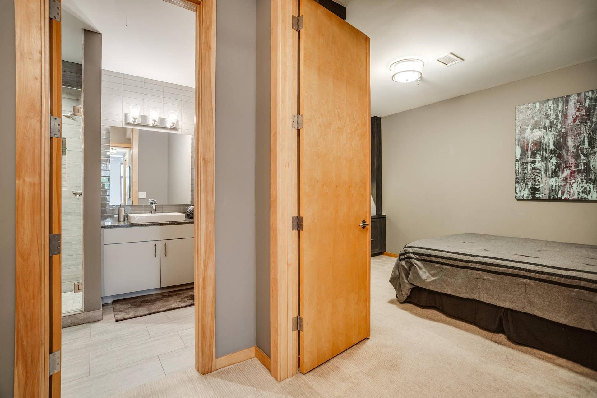 600 S 2nd Street, #S108, 18, Minneapolis, MN 55401 The designer bathroom is conveniently situated near the second bedroom.