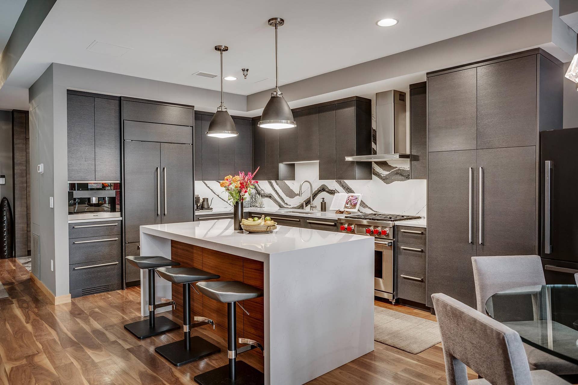 600 S 2nd Street, #S108, 18, Minneapolis, MN 55401 The chefs kitchen features a striking waterfall island with seating, Cambria countertops and statement backsplash, Wolf and Sub-Zero appliances, Miele built-in coffee maker, and gorgeous custom cabinetry.