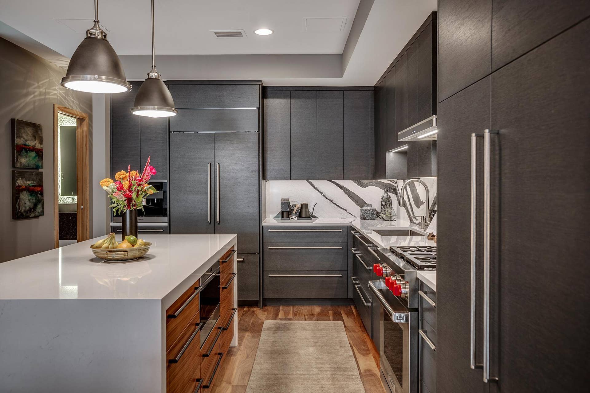 600 S 2nd Street, #S108, 18, Minneapolis, MN 55401 The chefs kitchen features a striking waterfall island with seating, Cambria countertops and statement backsplash, Wolf and Sub-Zero appliances, Miele built-in coffee maker, and gorgeous custom cabinetry.