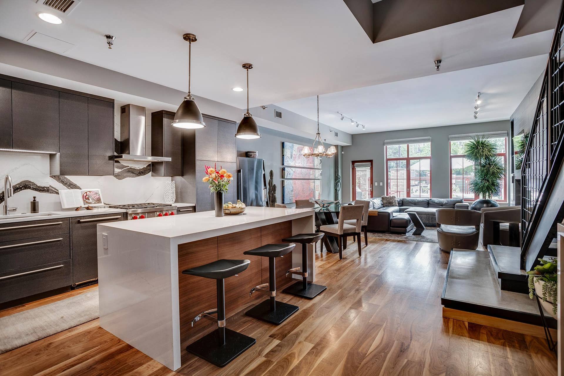 600 S 2nd Street, #S108, 18, Minneapolis, MN 55401 The interior architecture makes an immediate impression with oversized windows, tall ceilings, a sleek media wall, fireplace, and a modern iron and concrete staircase, a nod to the areas industrial history.