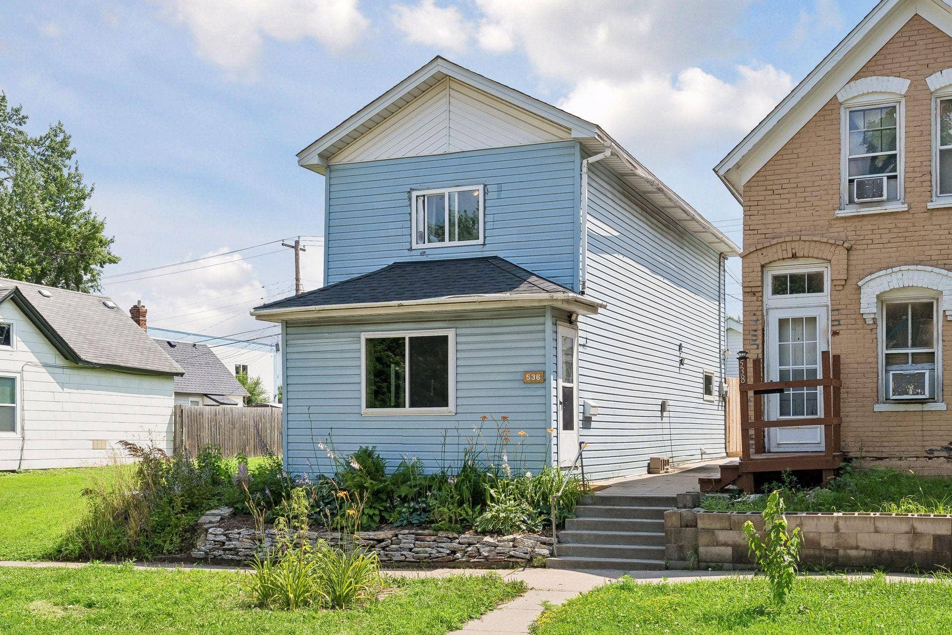 Welcome to 536 Sherburne Avenue in Saint Paul. Beautiful front gardens and concrete sidewalk to front door and rear garage.