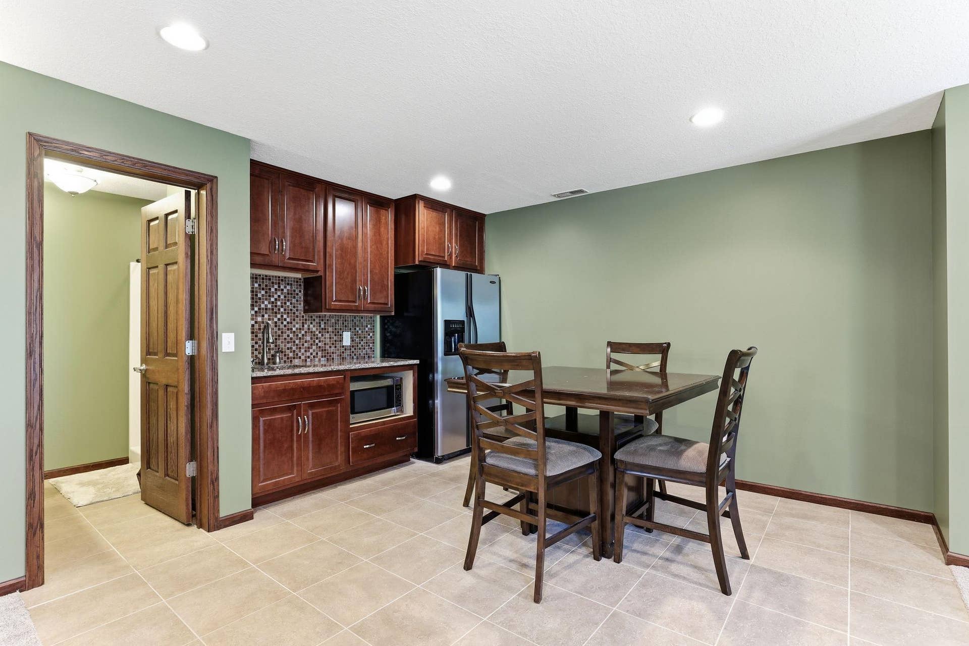 10360 Quail Avenue N, Brooklyn Park, MN 55443 Entertaining area in basement with wet bar.