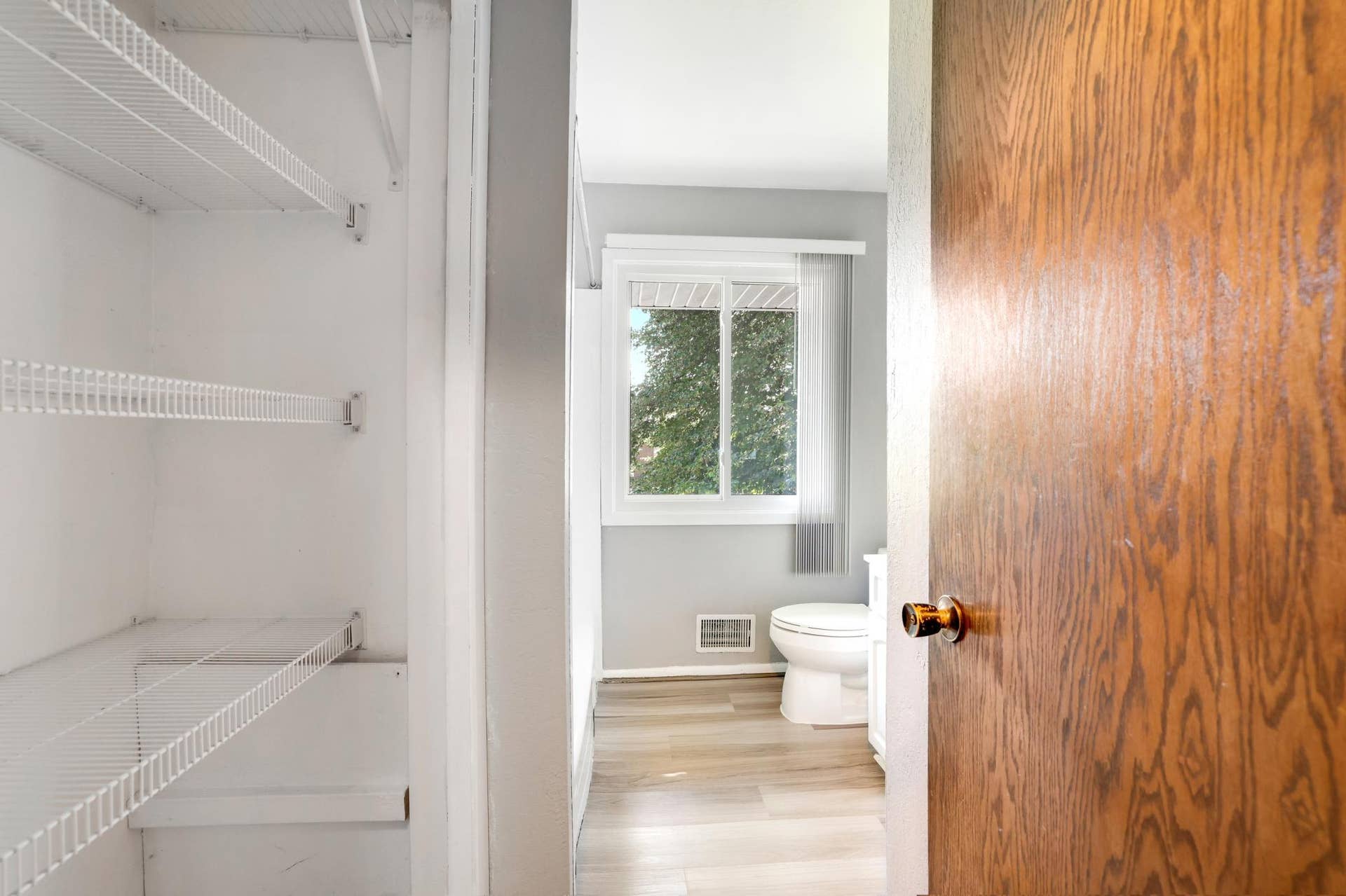 2741 Xylon Avenue N, New Hope, MN 55427 Main floor Full Bathroom with large storage closet & shelves.