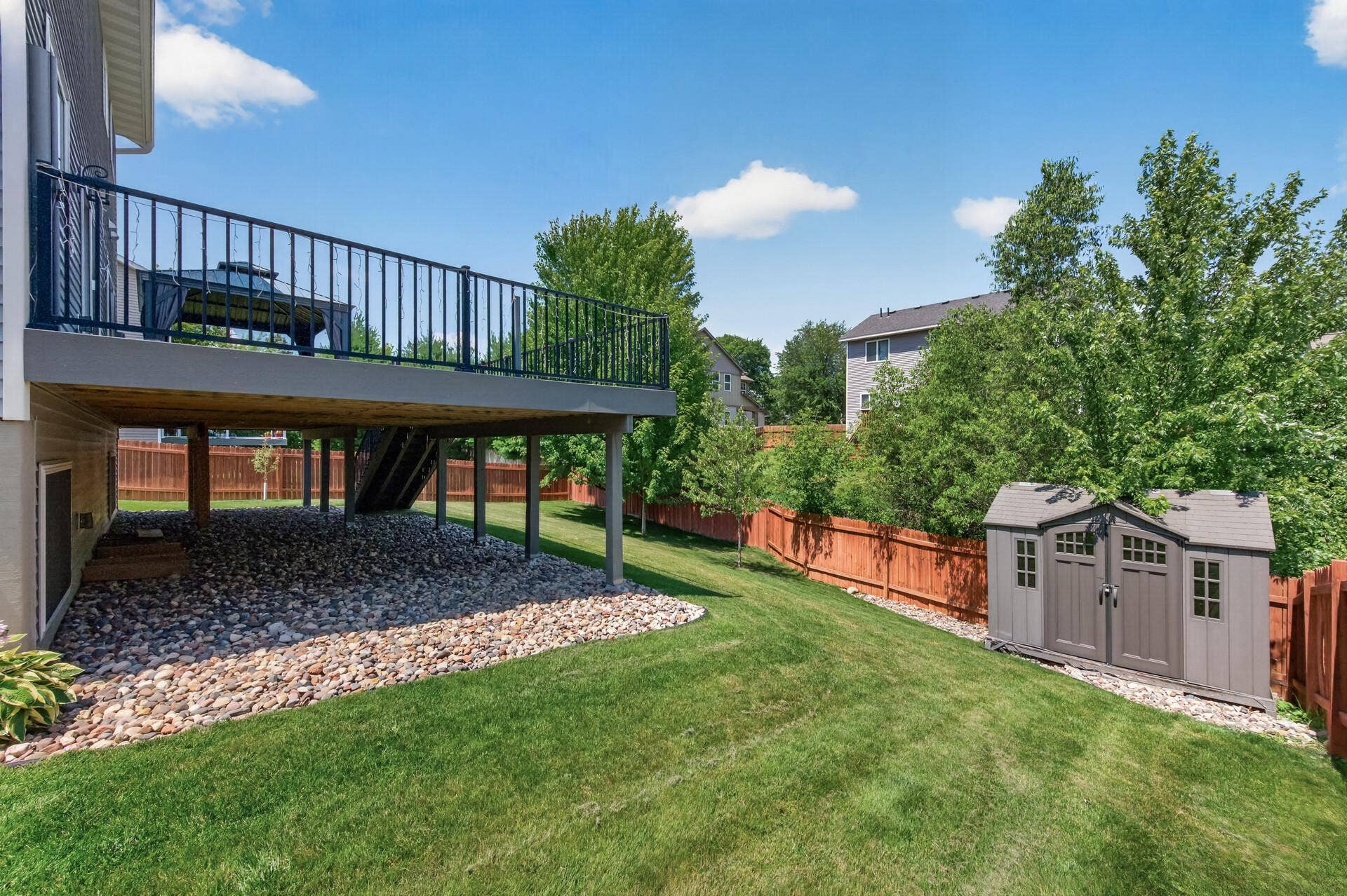 Back and side yard with storage shed