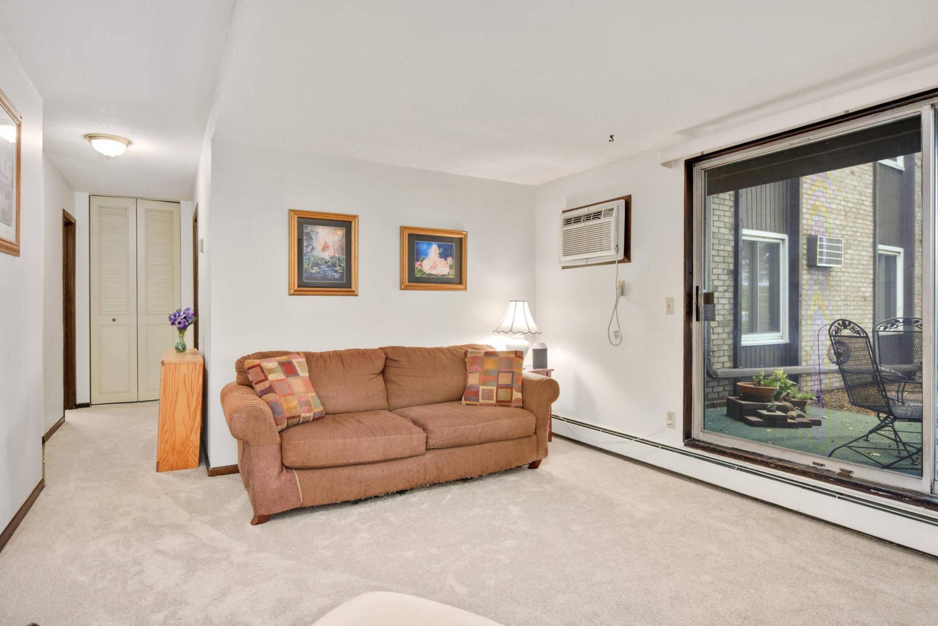4201 Lakeside Avenue N, #113, Brooklyn Center, MN 55429 Another view of the generous living room, offering flexible space for relaxing, entertaining, or everyday living.