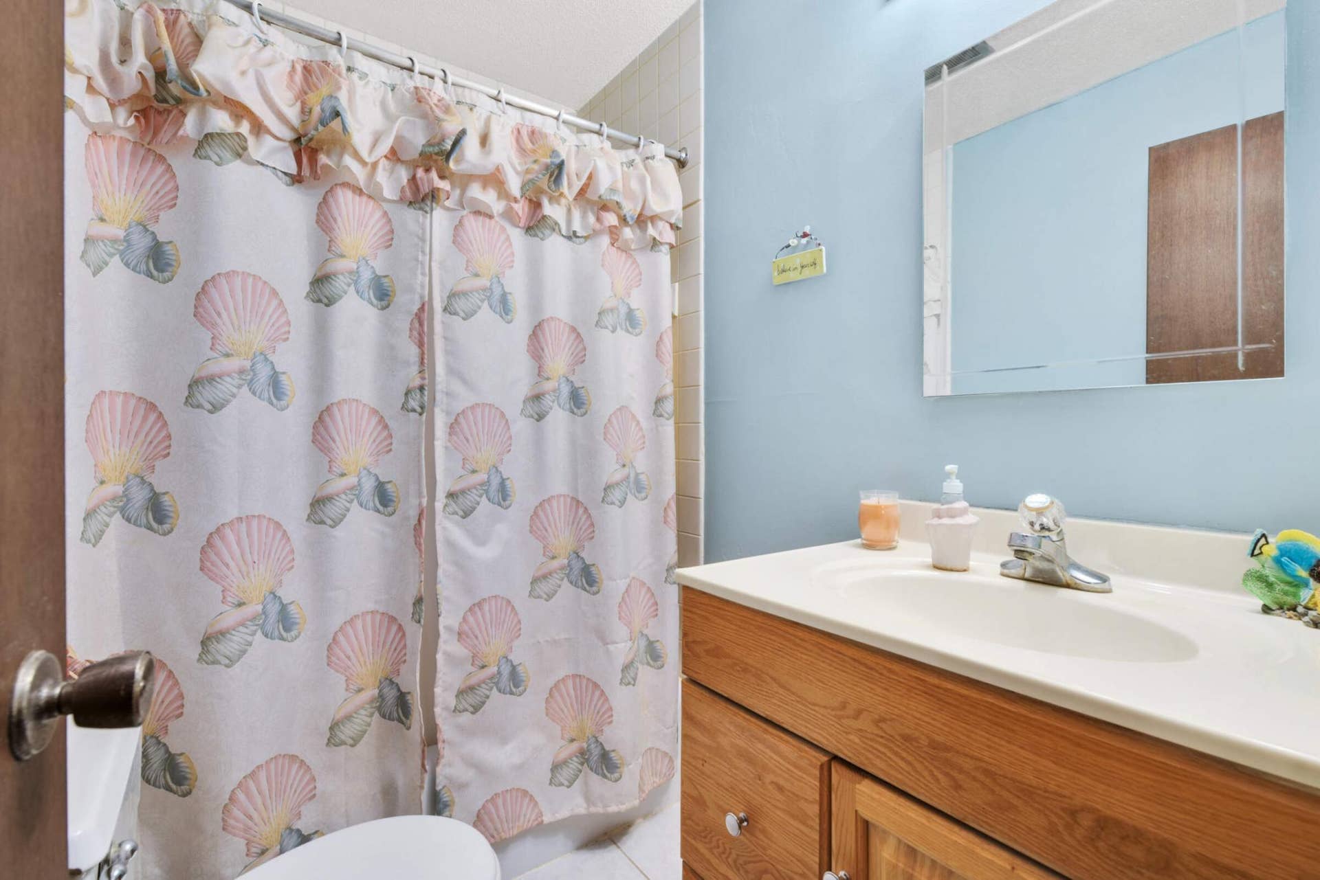 4201 Lakeside Avenue N, #113, Brooklyn Center, MN 55429 Clean, well-maintained full bathroom with updated vanity and a practical layout designed for everyday living.