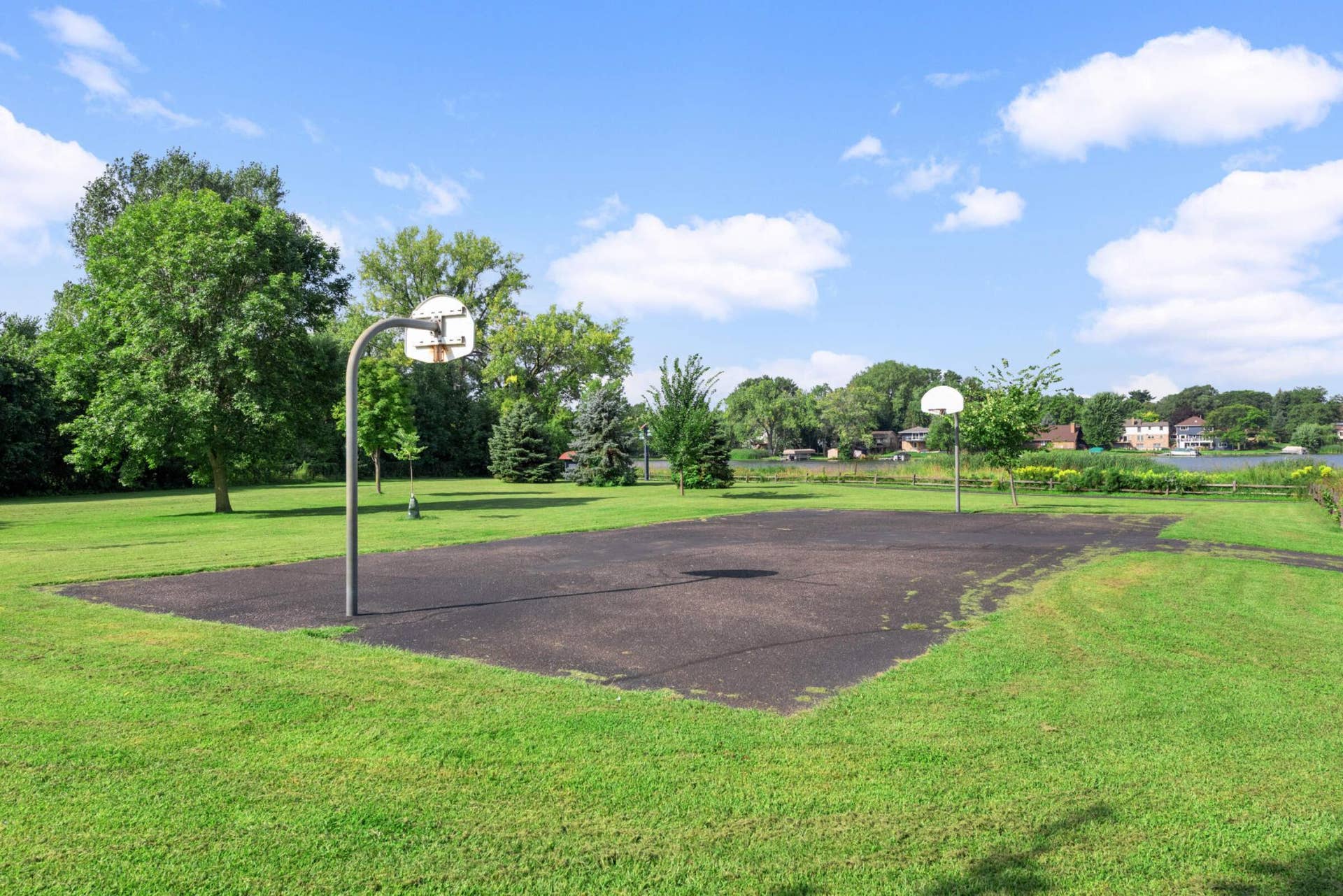 4201 Lakeside Avenue N, #113, Brooklyn Center, MN 55429 Outdoor basketball courts offer additional recreation just a short walk from the community.