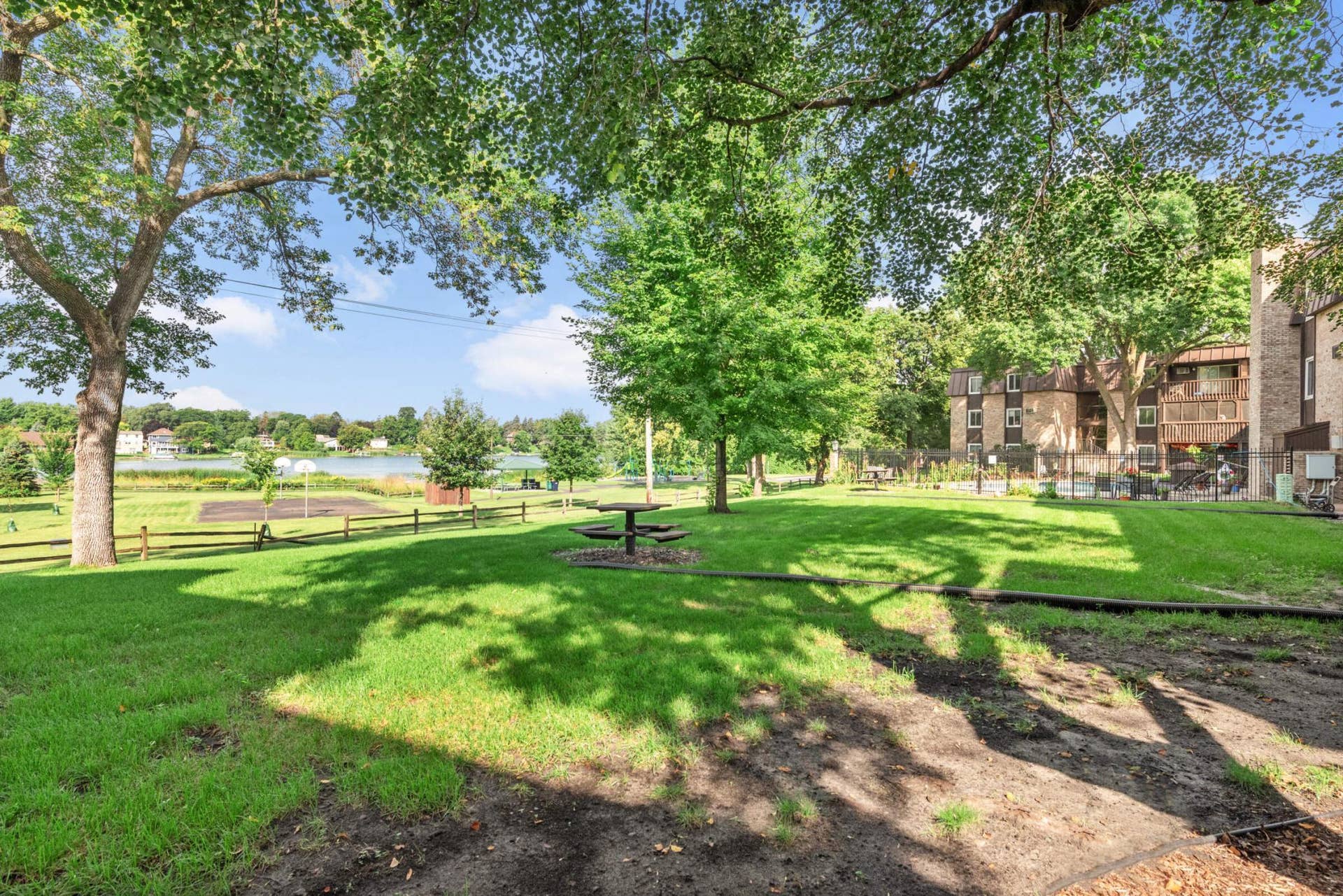 4201 Lakeside Avenue N, #113, Brooklyn Center, MN 55429 Enjoy direct access to open green space leading toward Twin Lake and nearby recreational amenities.