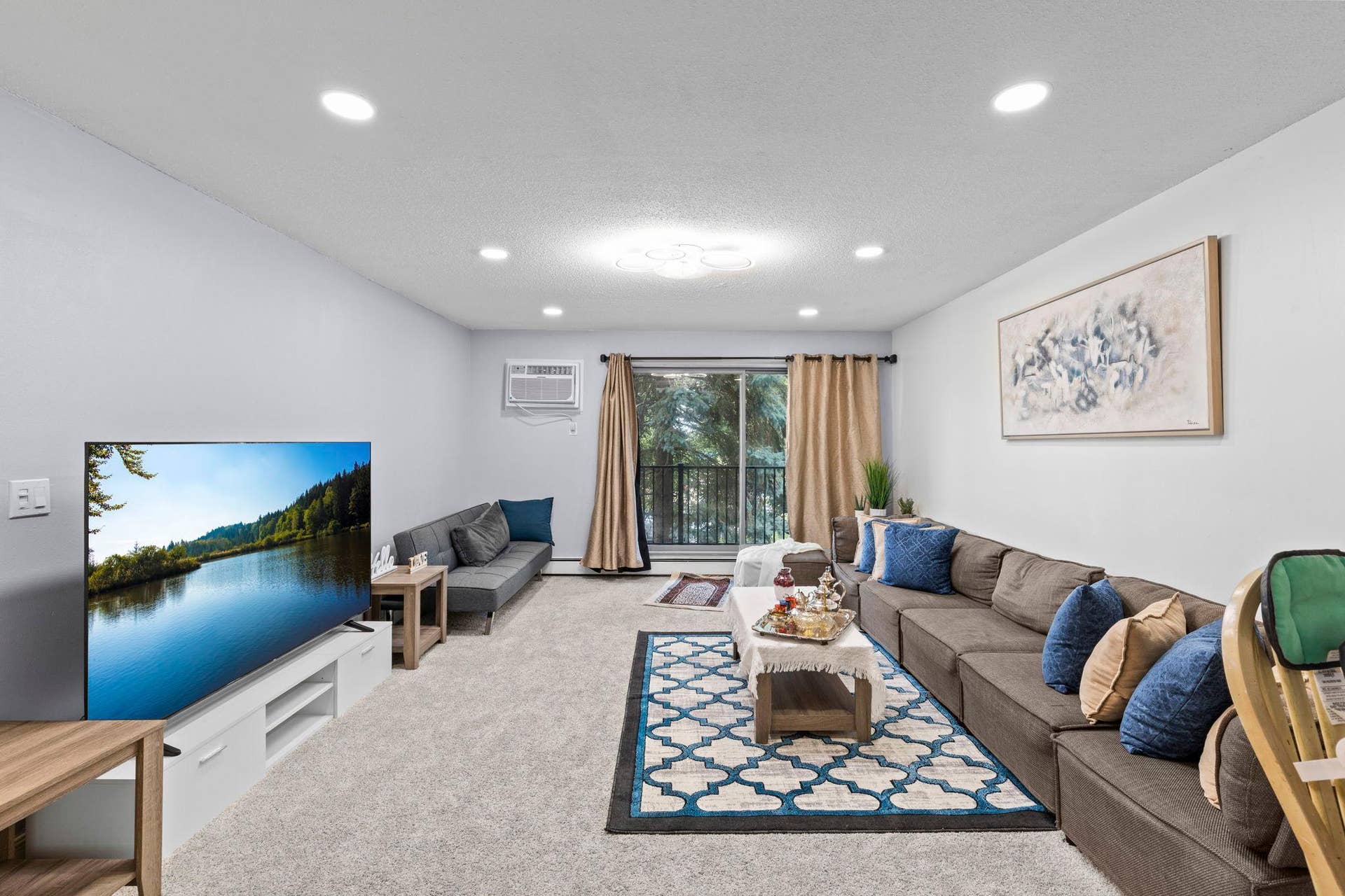 4201 Lakeside Avenue N, #214, Brooklyn Center, MN 55429 An alternate view of the spacious living room showcasing the open layout and inviting atmosphere.