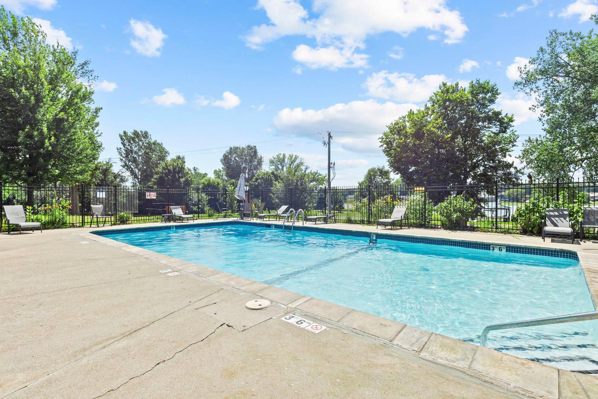 4201 Lakeside Avenue N, #214, Brooklyn Center, MN 55429 The shared community pool offers the perfect space for enjoying summer days, relaxing, and creating lasting memories.