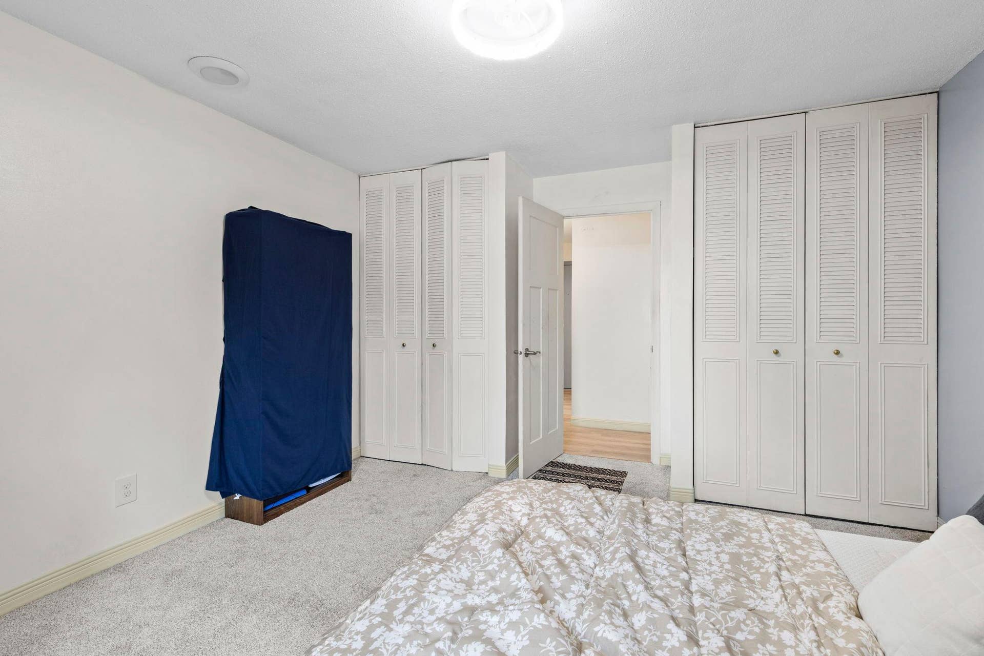 4201 Lakeside Avenue N, #214, Brooklyn Center, MN 55429 Another view of the bedroom showcasing the dual closets and providing ample storage space.