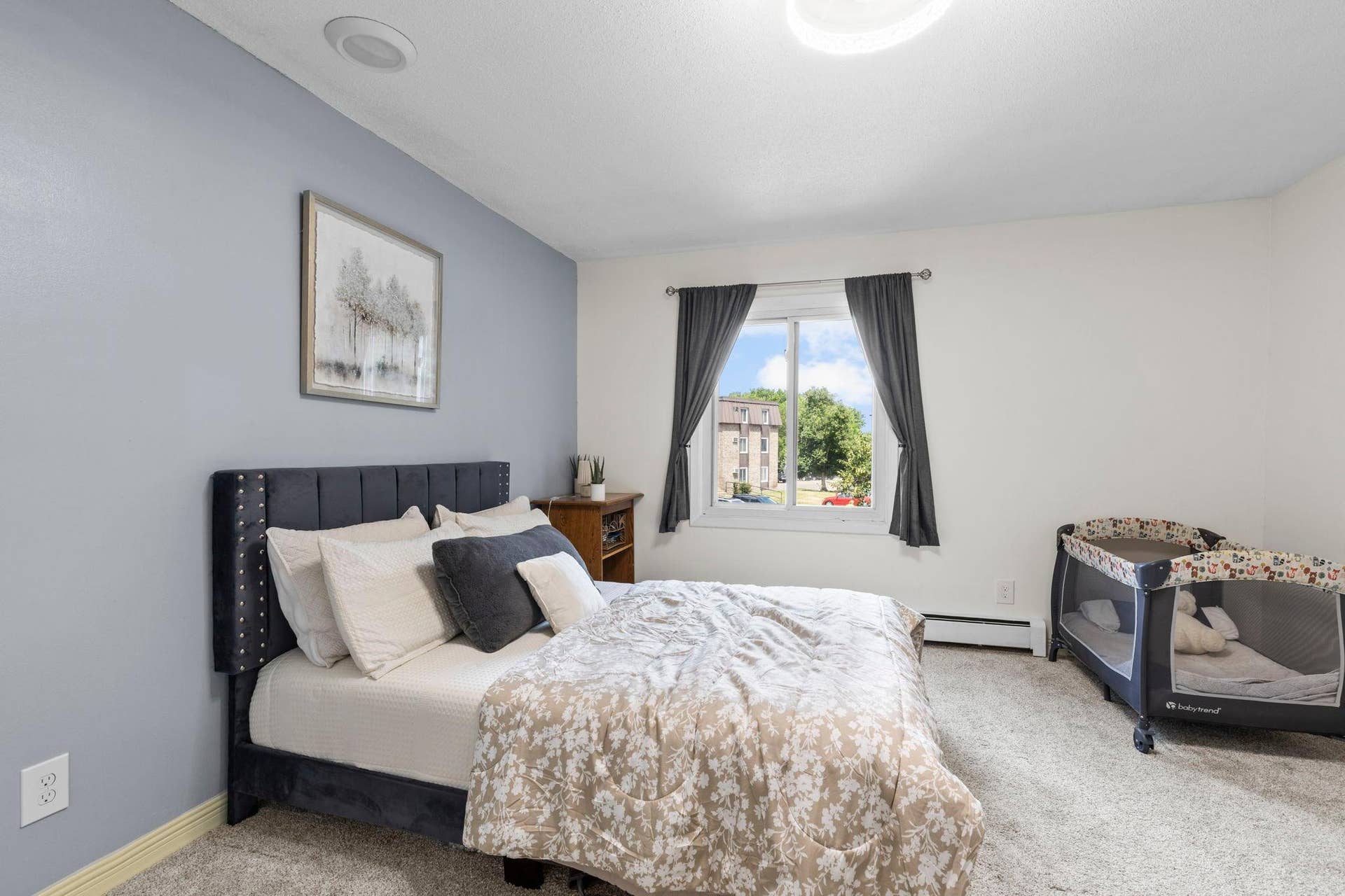 4201 Lakeside Avenue N, #214, Brooklyn Center, MN 55429 The spacious bedroom offers dual closets and carpeting.
