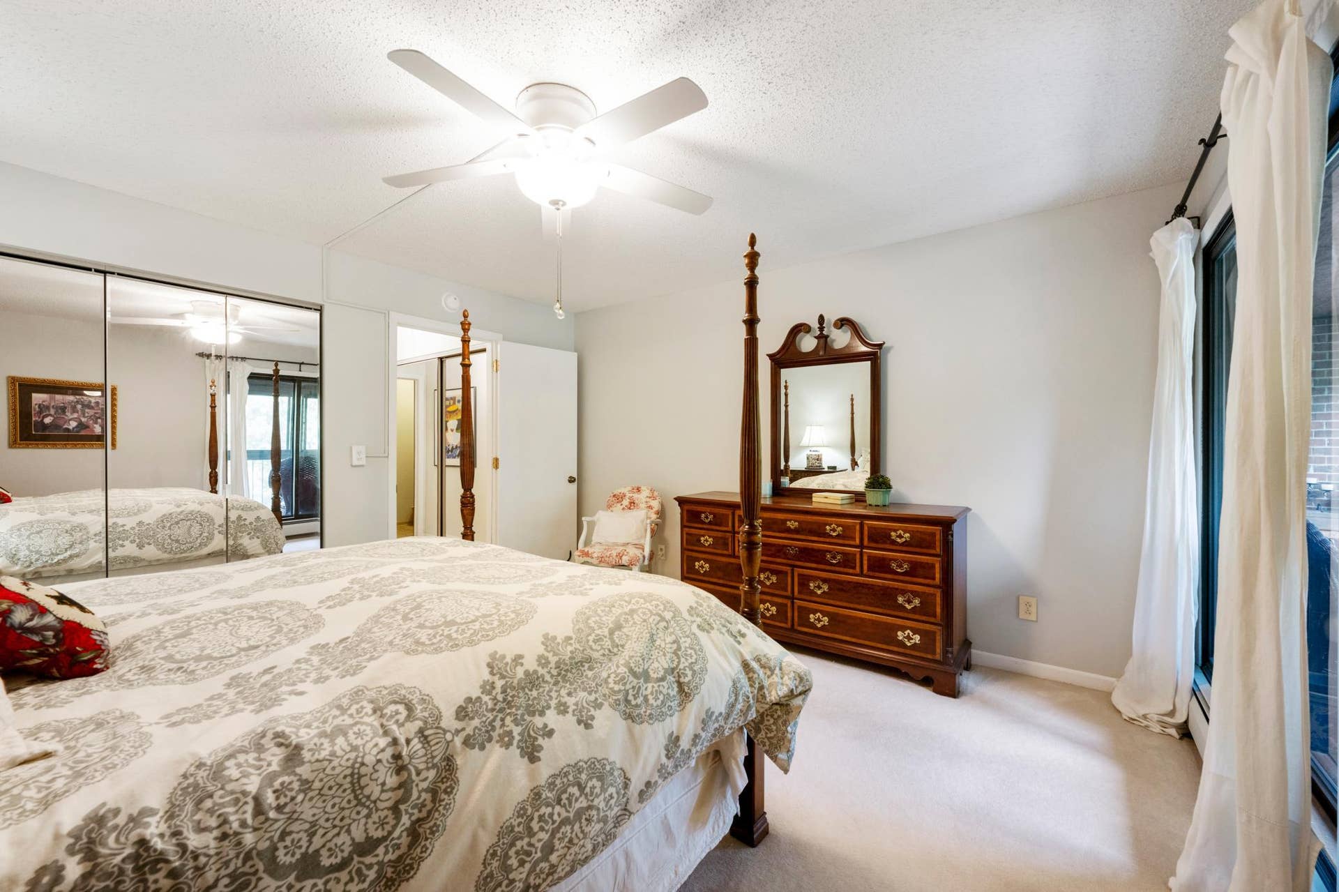 1800 Riverwood Drive, #301, Burnsville, MN 55337 Spacious closet on one wall and an updated ceiling fan/light.