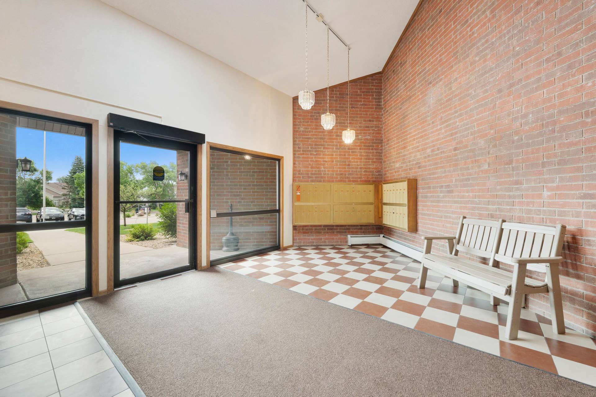 1800 Riverwood Drive, #301, Burnsville, MN 55337 A large, well lit front foyer of brick and tile welcomes your guests.