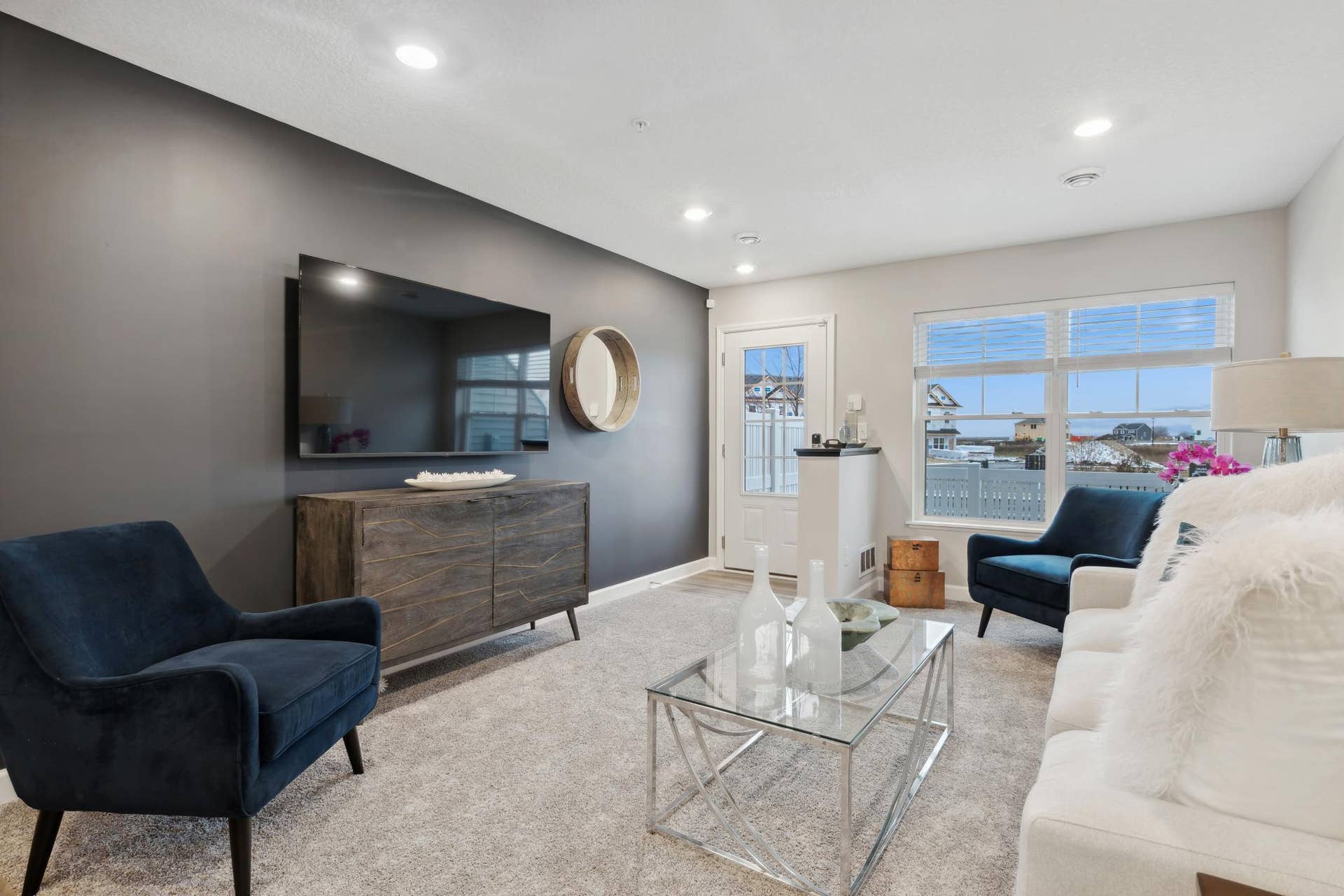 (Photo of a decorated model, actual homes finishes will vary) Another view of the great room that flows into the kitchen!