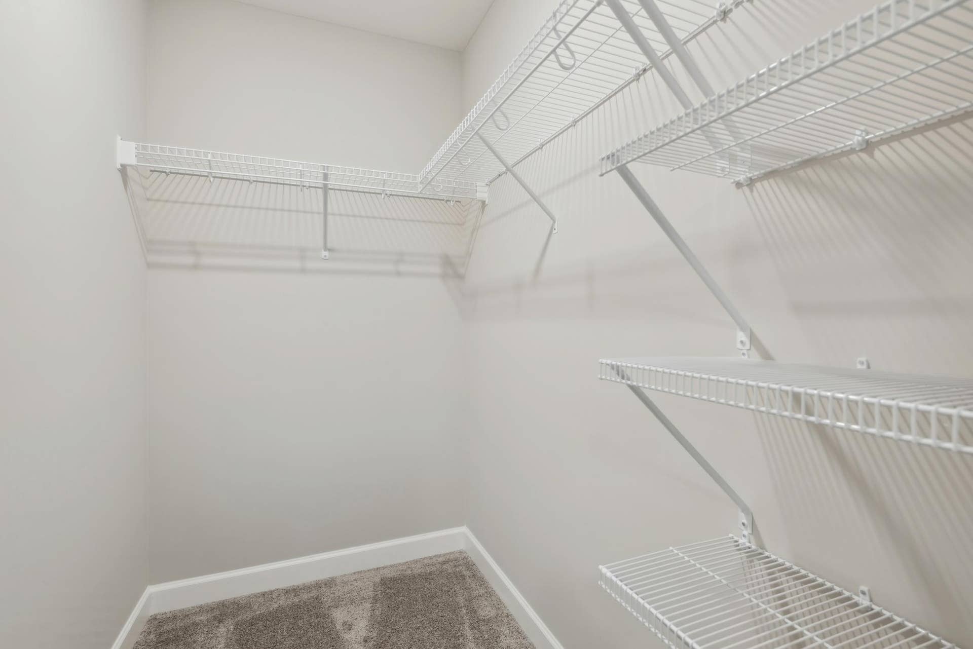 (Photo of a decorated model, actual homes finishes will vary) The primary bedroom features an incredible walk-in closet.