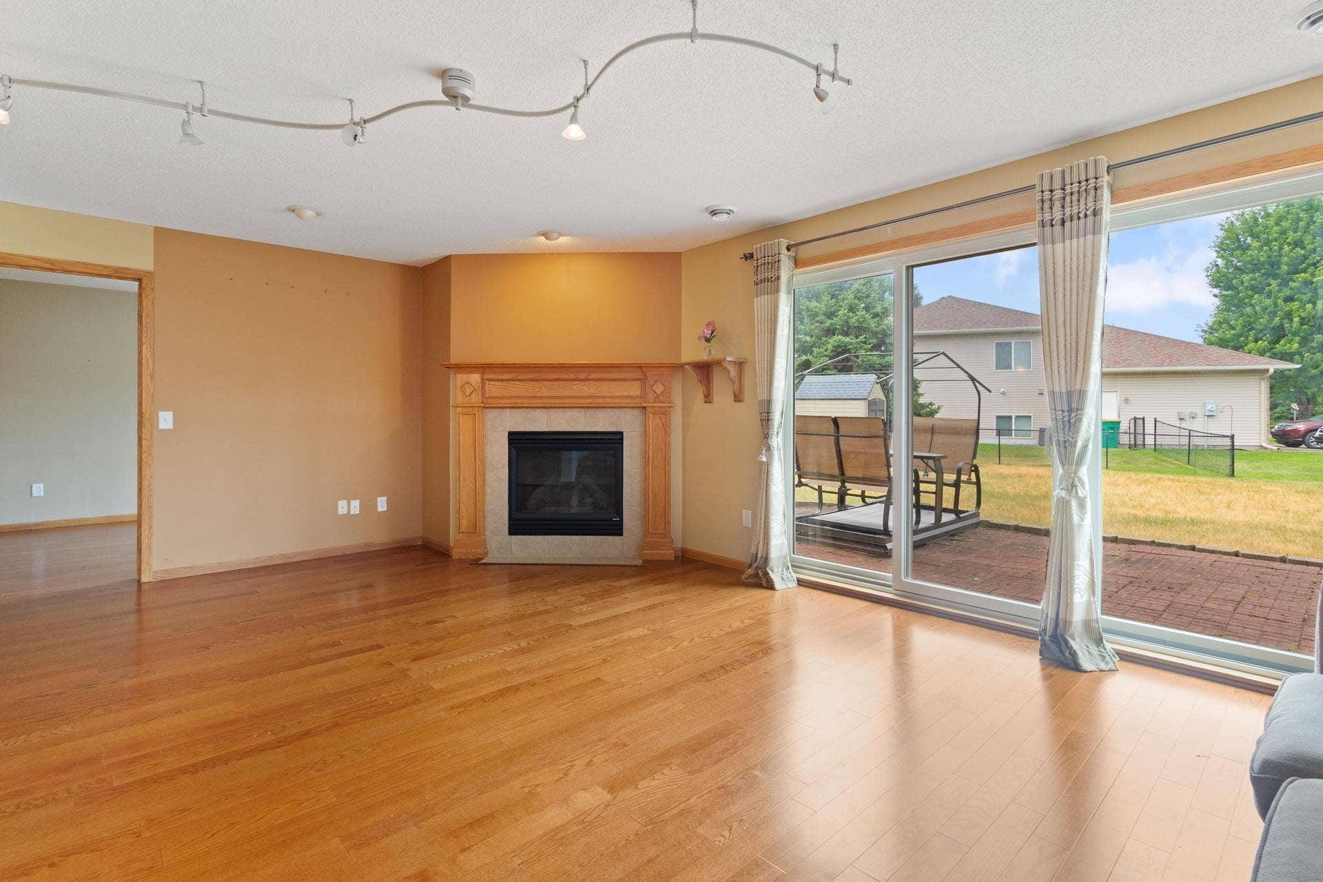 10049 Butternut Court N, Brooklyn Park, MN 55443 05 Large main level family room with gas fireplace.jpg
