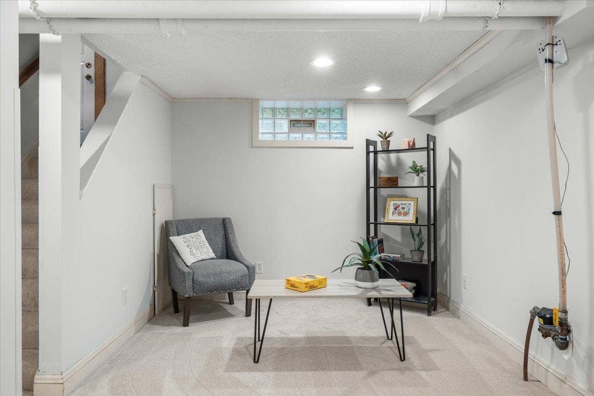 Alternate view of lower level-the photo features the water line...yep that can be concealed in an HGTV kinda way.