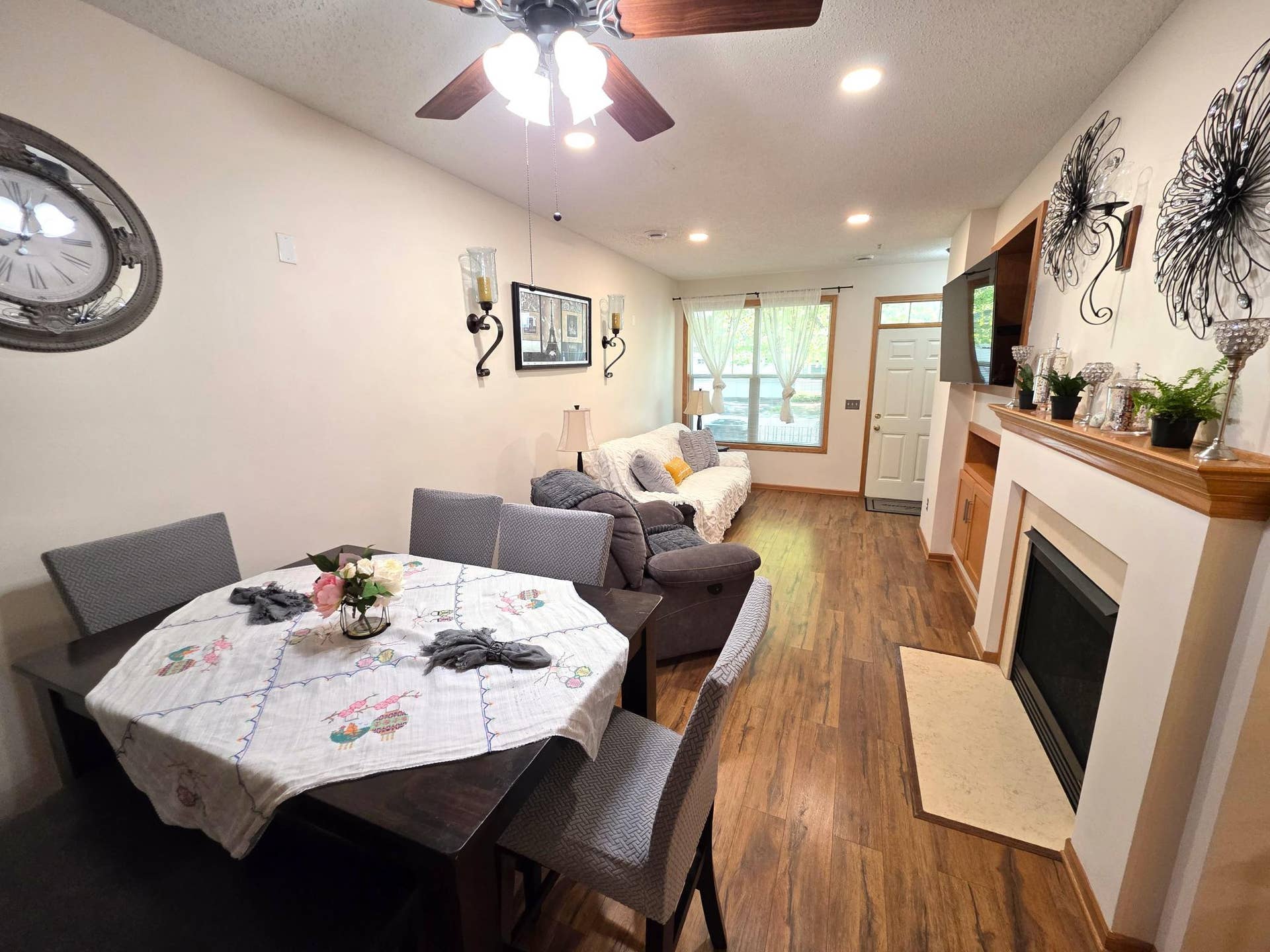1611 Woodlynn Avenue, #3, Maplewood, MN 55109 This bright, open-concept living and dining area features a cozy gas fireplace. Perfect for hanging out or watching TV.