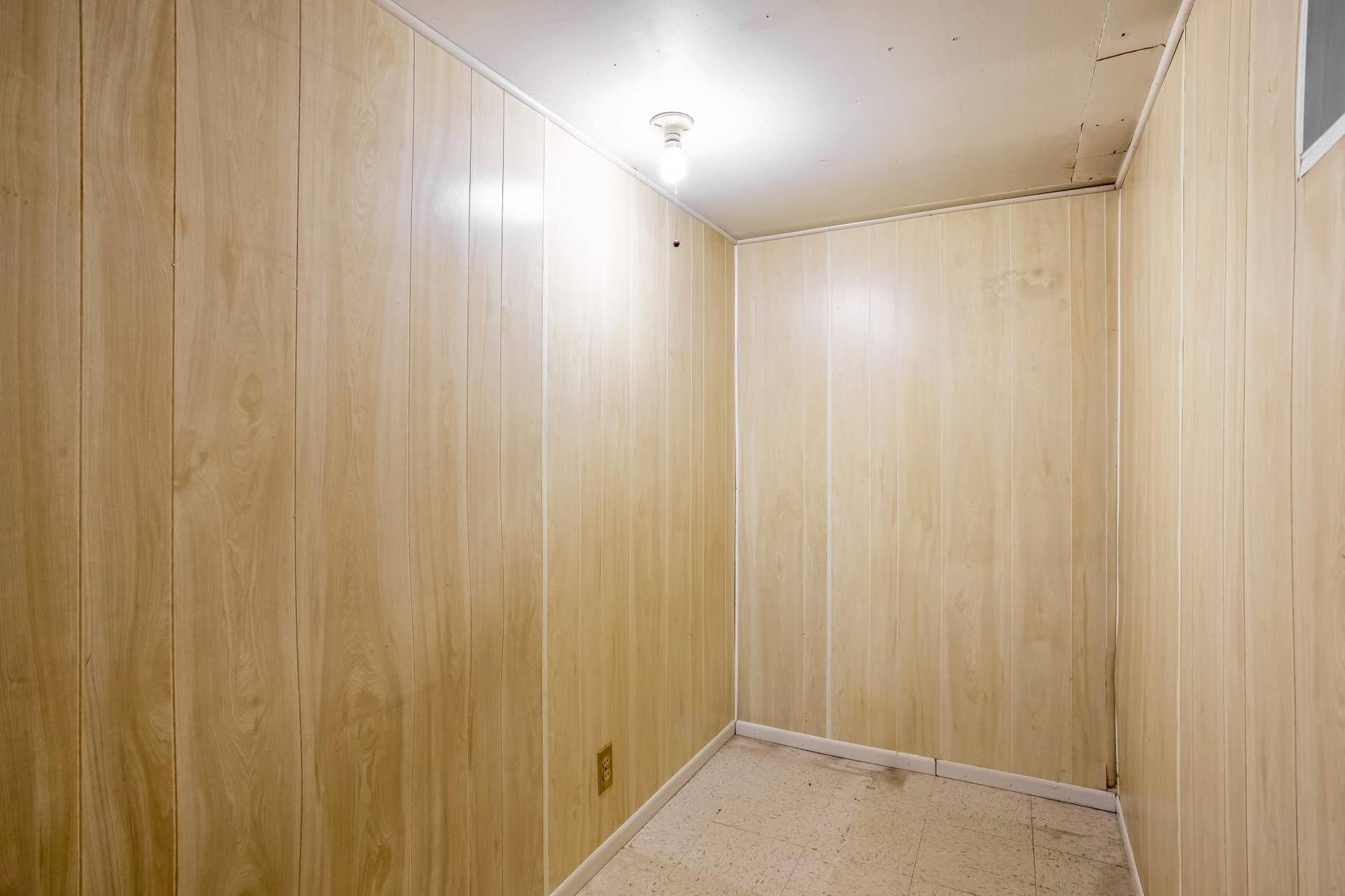 Bonus lower-level room provides additional space well suited for storage, organization, or other household needs.