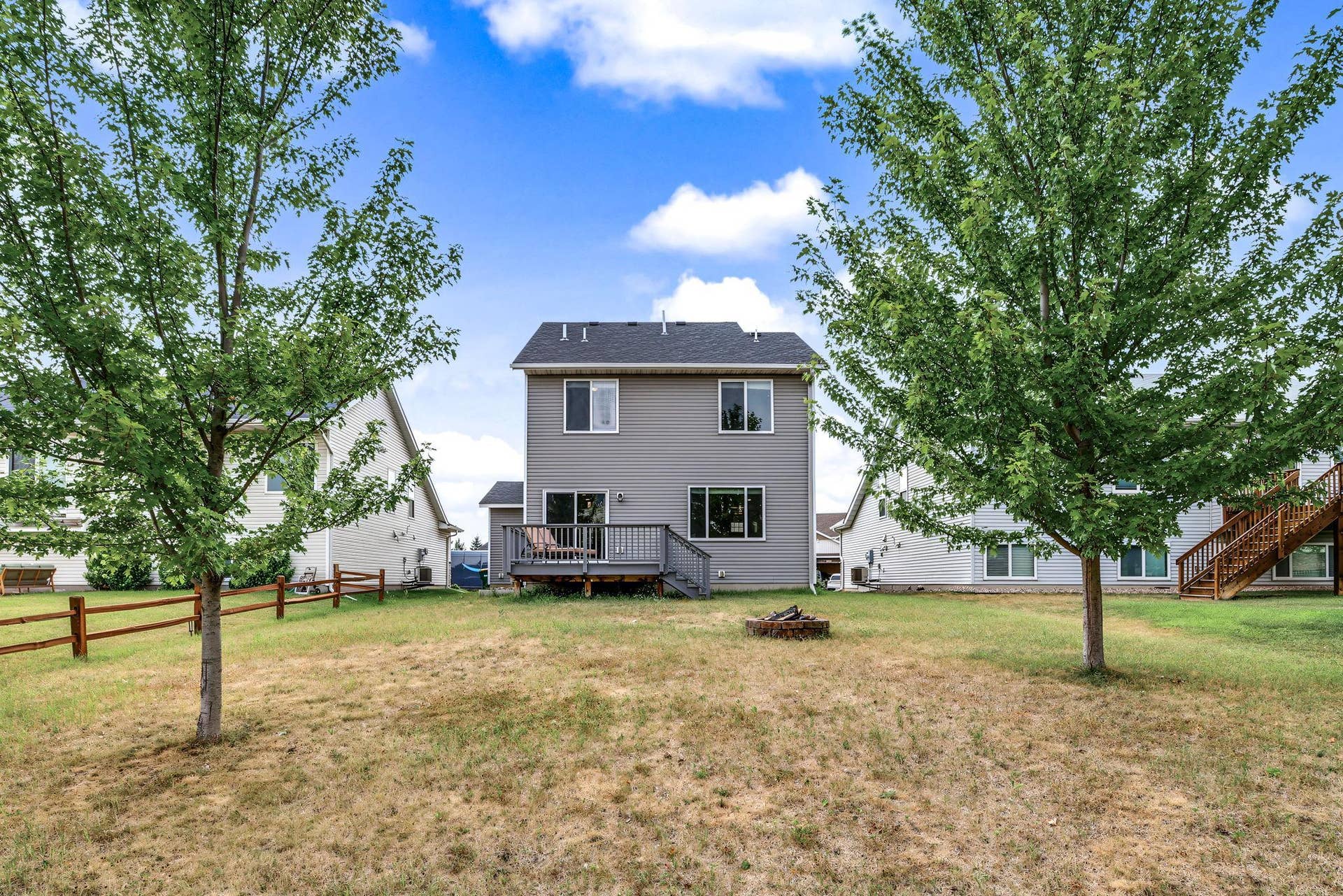 9415 Toledo Lane N, Brooklyn Park, MN 55443 Enjoy the backyard firepit, and the quickly maturing shade trees