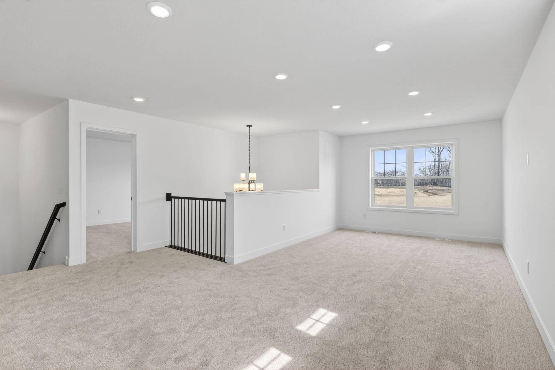 11180 Masters Street N, Lake Elmo, MN 55042 (Photo of a similar home, actual finishes may vary) Centrally located on the second floor, the loft adds shared living space that could be a space for movies and games.