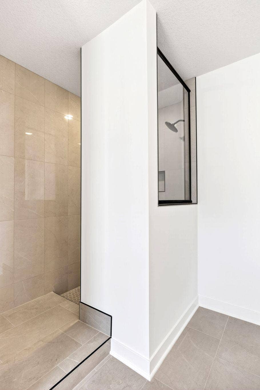 11180 Masters Street N, Lake Elmo, MN 55042 (Photo of a similar home, actual finishes may vary) A luxe soaking tub and a Serenity shower contribute to a spa-like atmosphere