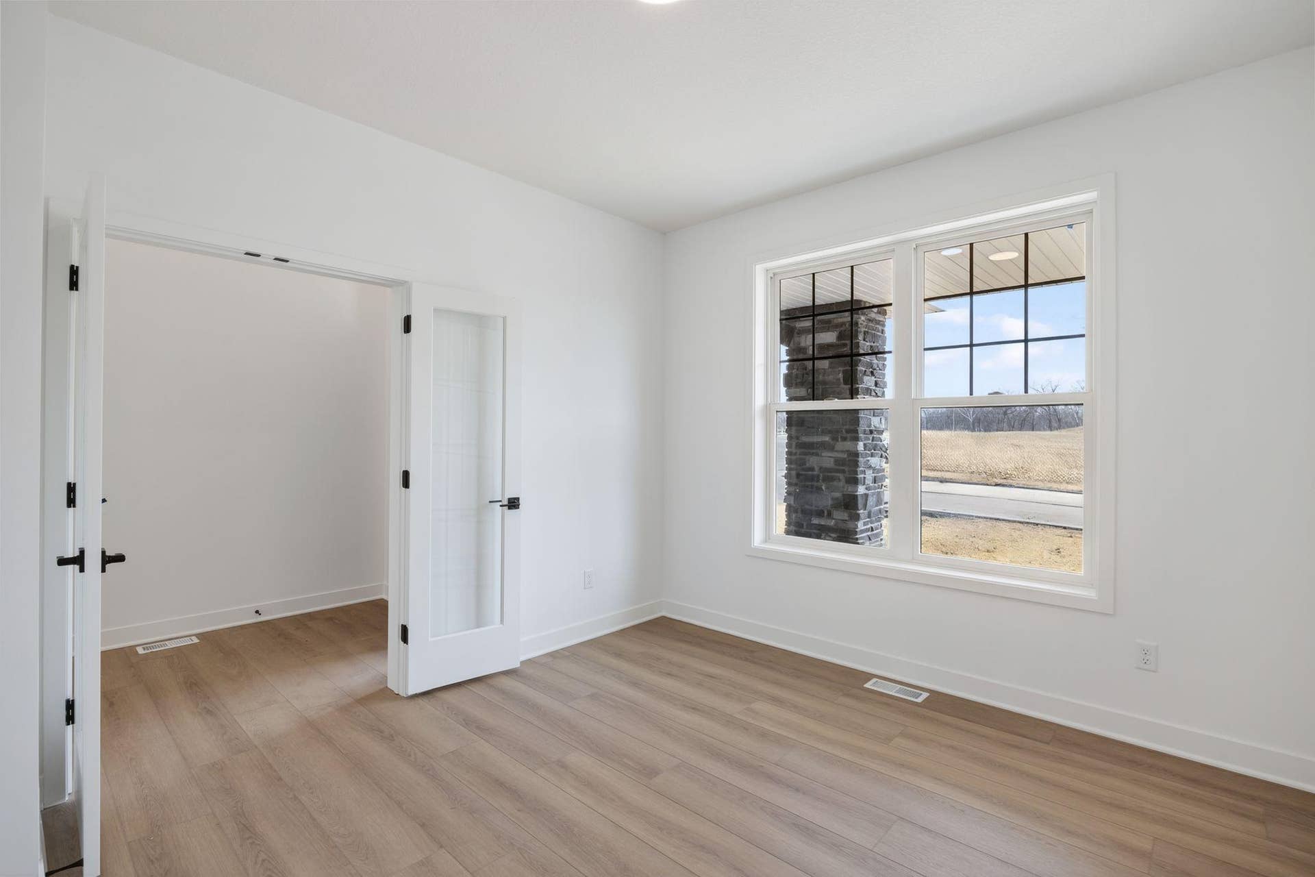 11180 Masters Street N, Lake Elmo, MN 55042 (Photo of a similar home, actual finishes may vary) This office is sequestered from the main level living facilities, making it perfect for at home work.