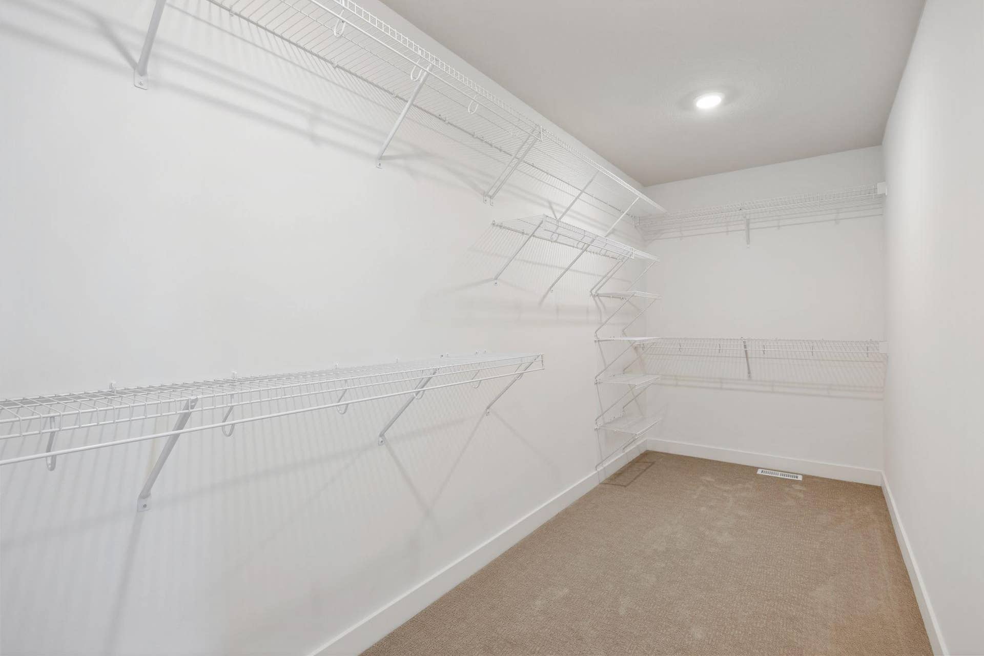 11180 Masters Street N, Lake Elmo, MN 55042 (Photo of a similar home, actual finishes may vary) Expansive walk-in closet in owner's suite