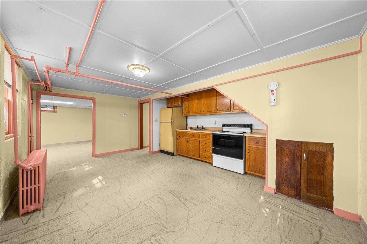 Lower level has a kitchenet, bedroom, and laundry