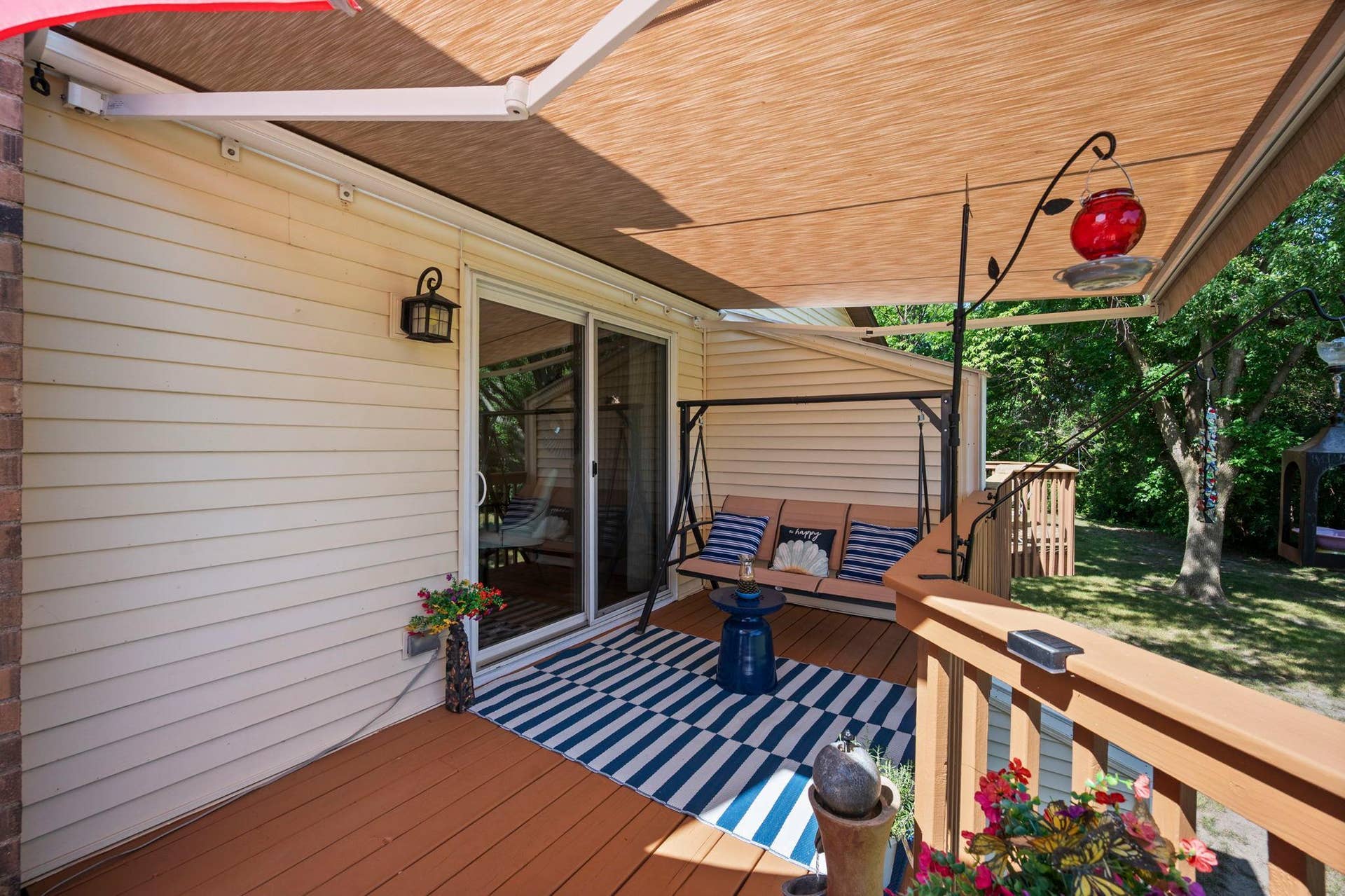 14333 91st Place N, Maple Grove, MN 55369 This large deck is right off the dining area. The owners had an "intelligent" retractable awning installed and it stays with the house!