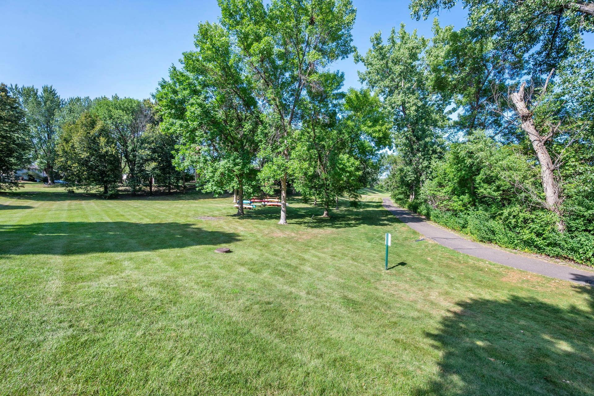 14333 91st Place N, Maple Grove, MN 55369 The canoe/kayak storage racks are a short walk from the home down the walking path which goes all around Rice Lake. The HOA offers canoe storage for a fee.