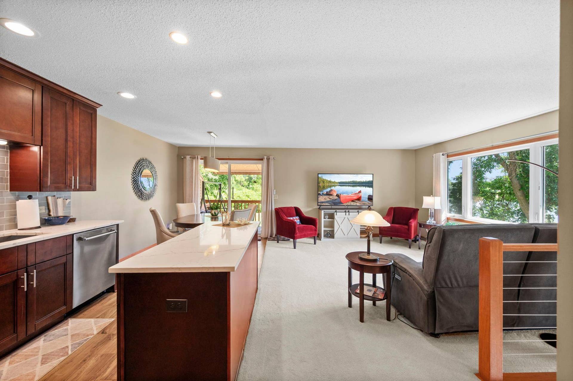 14333 91st Place N, Maple Grove, MN 55369 Open kitchen, dining and living room area with view out to the deck.