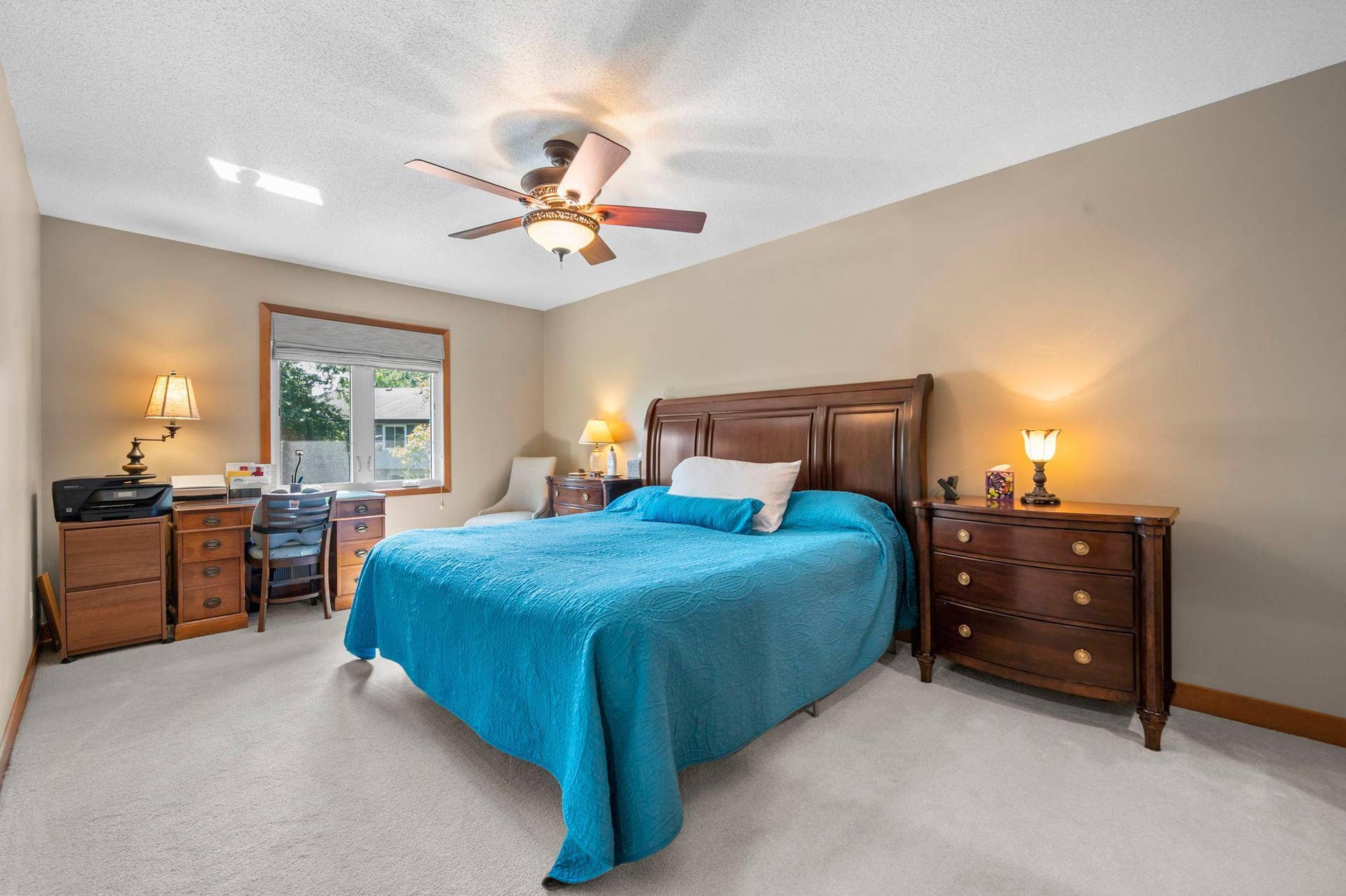 14333 91st Place N, Maple Grove, MN 55369 The primary bedroom is big! It has newer windows and neutral carpet and a ceiling fan.