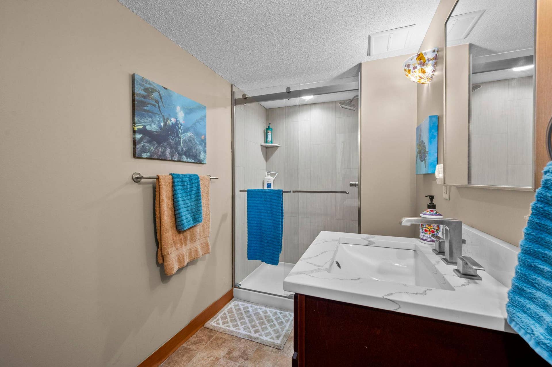 14333 91st Place N, Maple Grove, MN 55369 Remodeled downstairs bathroom with quality features and gorgeous tiled, step-in shower.
