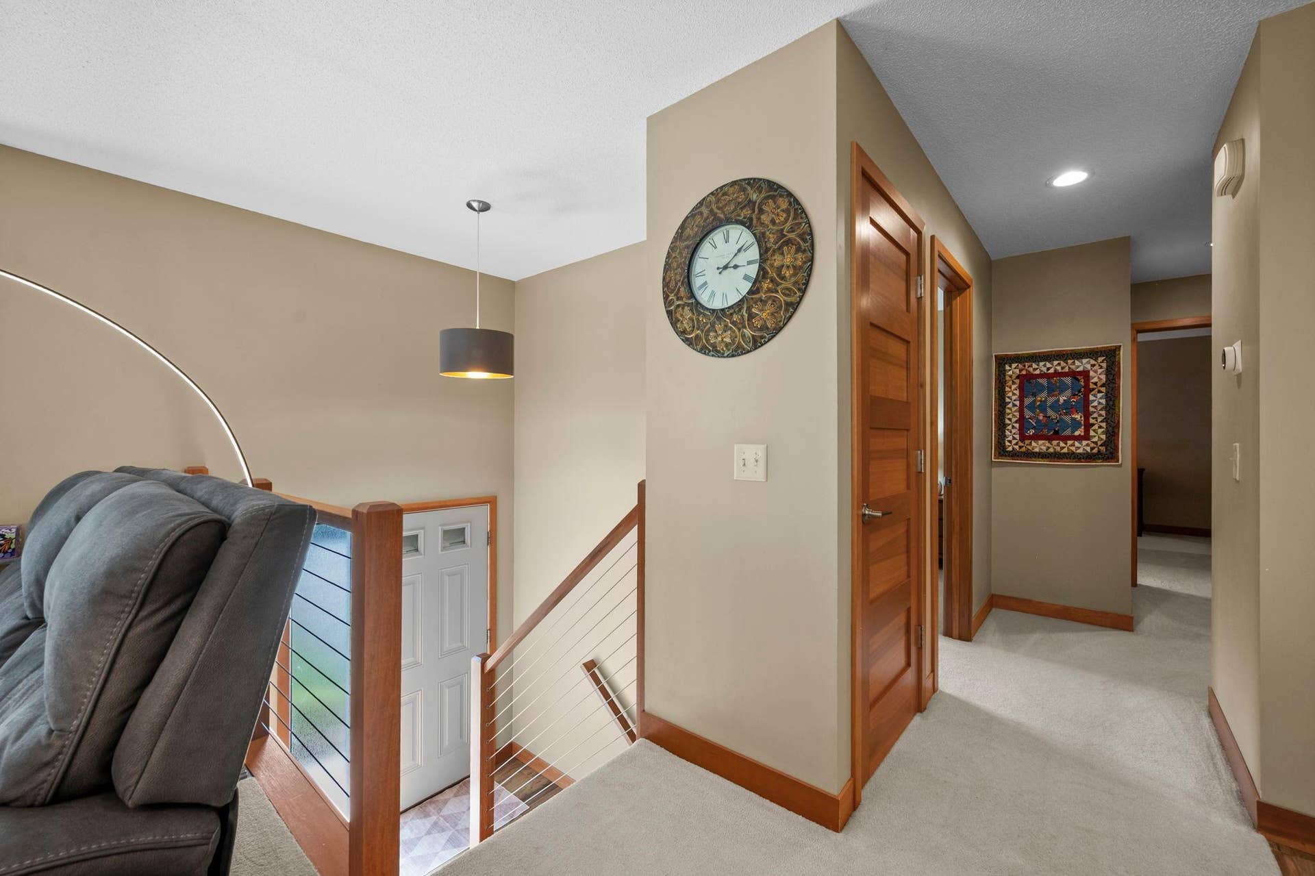 14333 91st Place N, Maple Grove, MN 55369 Top of the stairs - classy wood railings and natural wood steps.