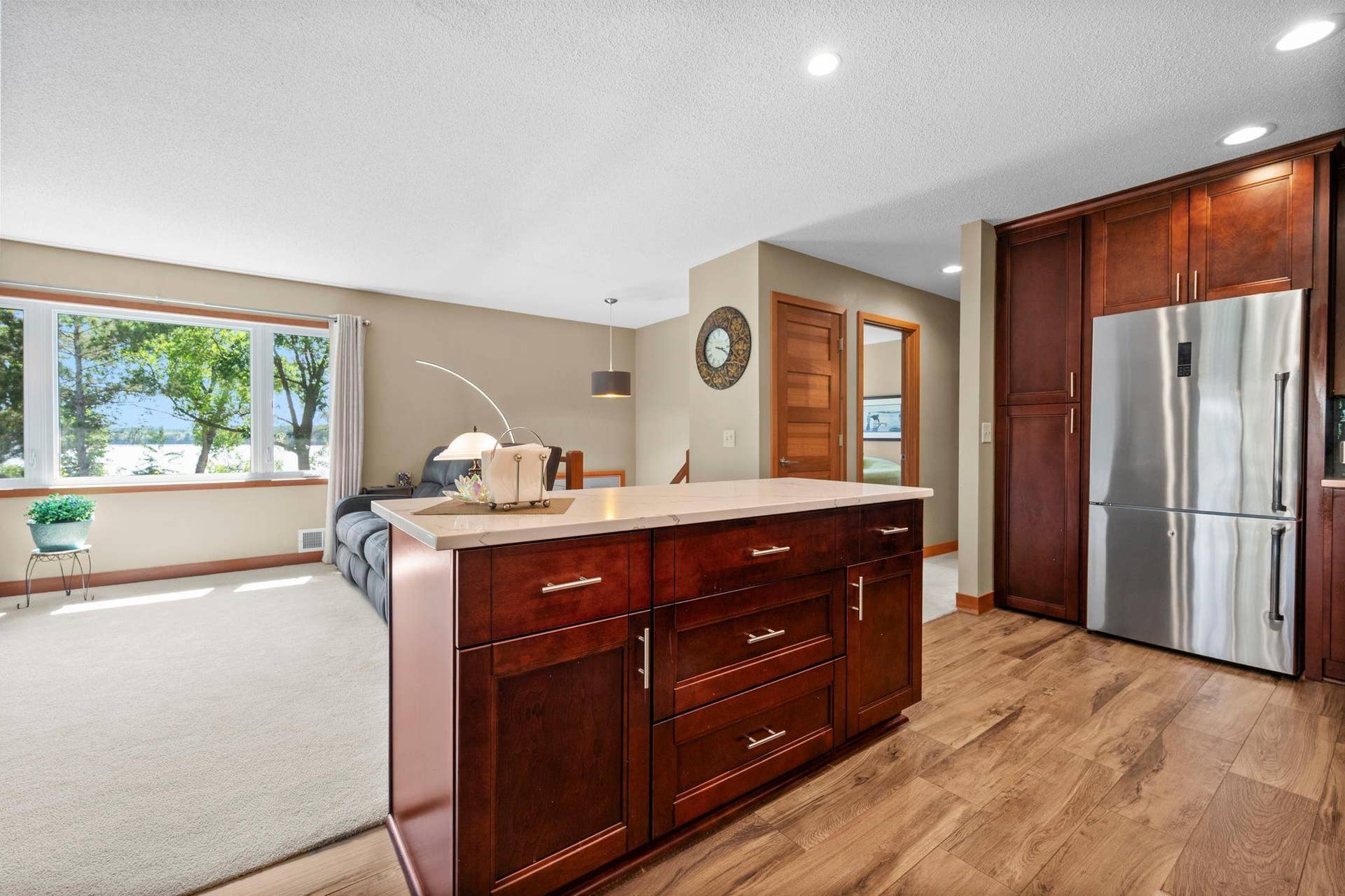 14333 91st Place N, Maple Grove, MN 55369 Open kitchen concept with large island, tons of cabinets and porcelain tile floors.
