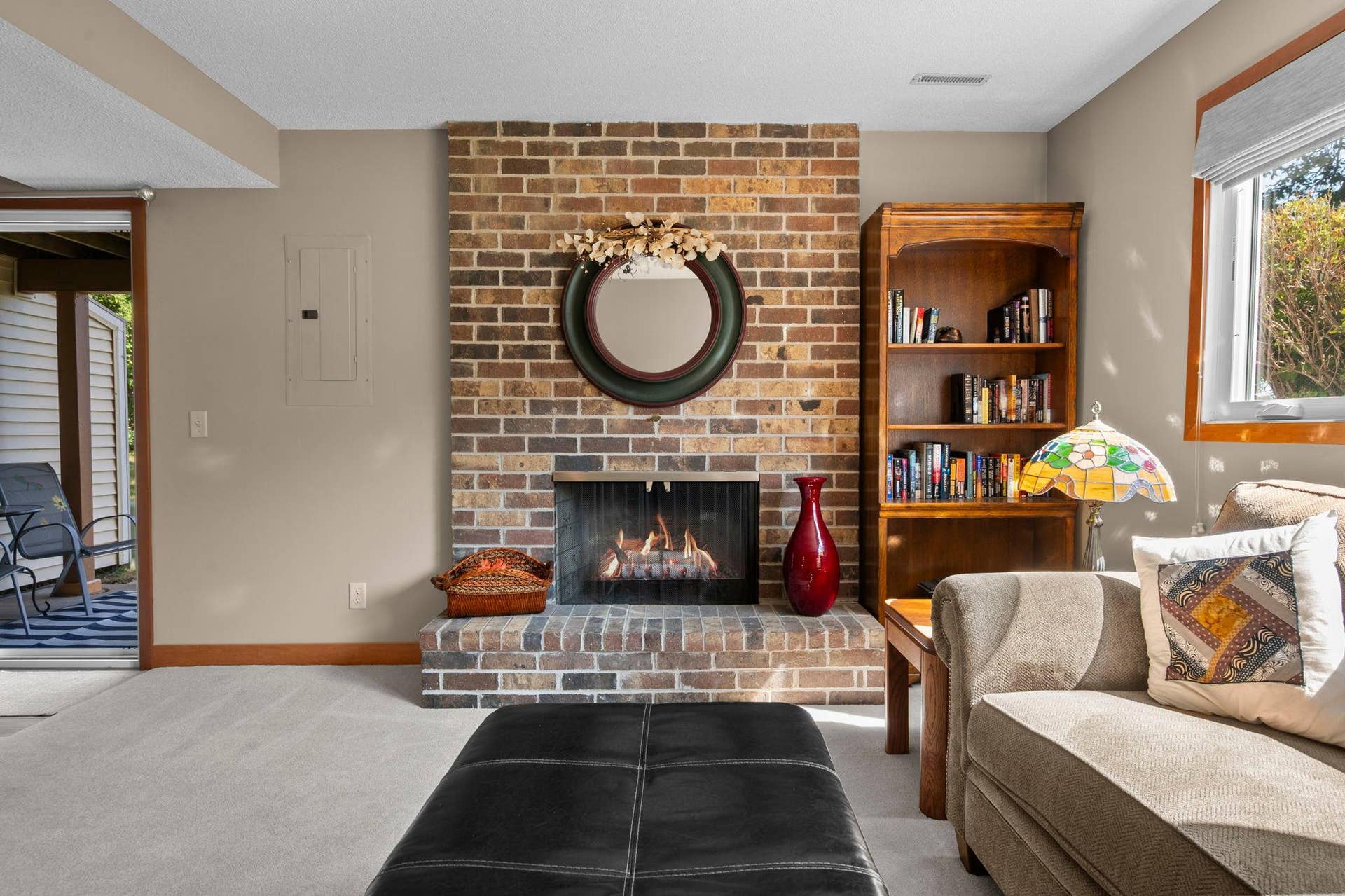 14333 91st Place N, Maple Grove, MN 55369 L-shaped family room walks out to a private patio and a huge grassy area between the house and lake.