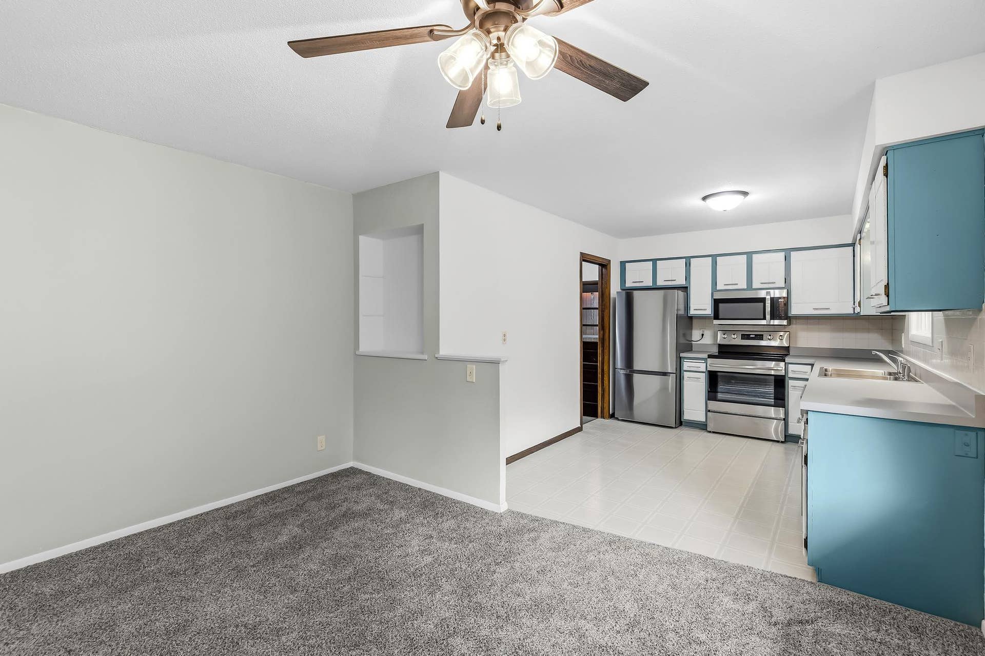 Open dining area flows seamlessly into the kitchen, offering a comfortable space for everyday meals and entertaining. Bright kitchen features stainless-steel appliances, ample cabinetry and a functional layout.
