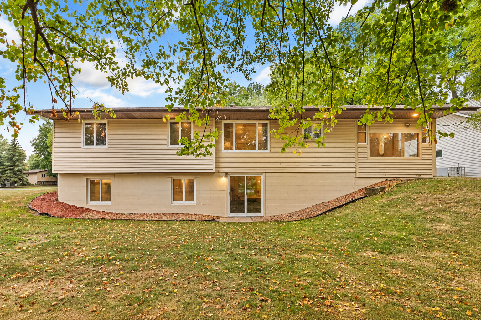Unique Walkout Rambler!  A rare design featuring a spacious walkout lower level with direct backyard access. Large windows bring in plenty of natural light, while the mature trees and peaceful setting create a private feel.