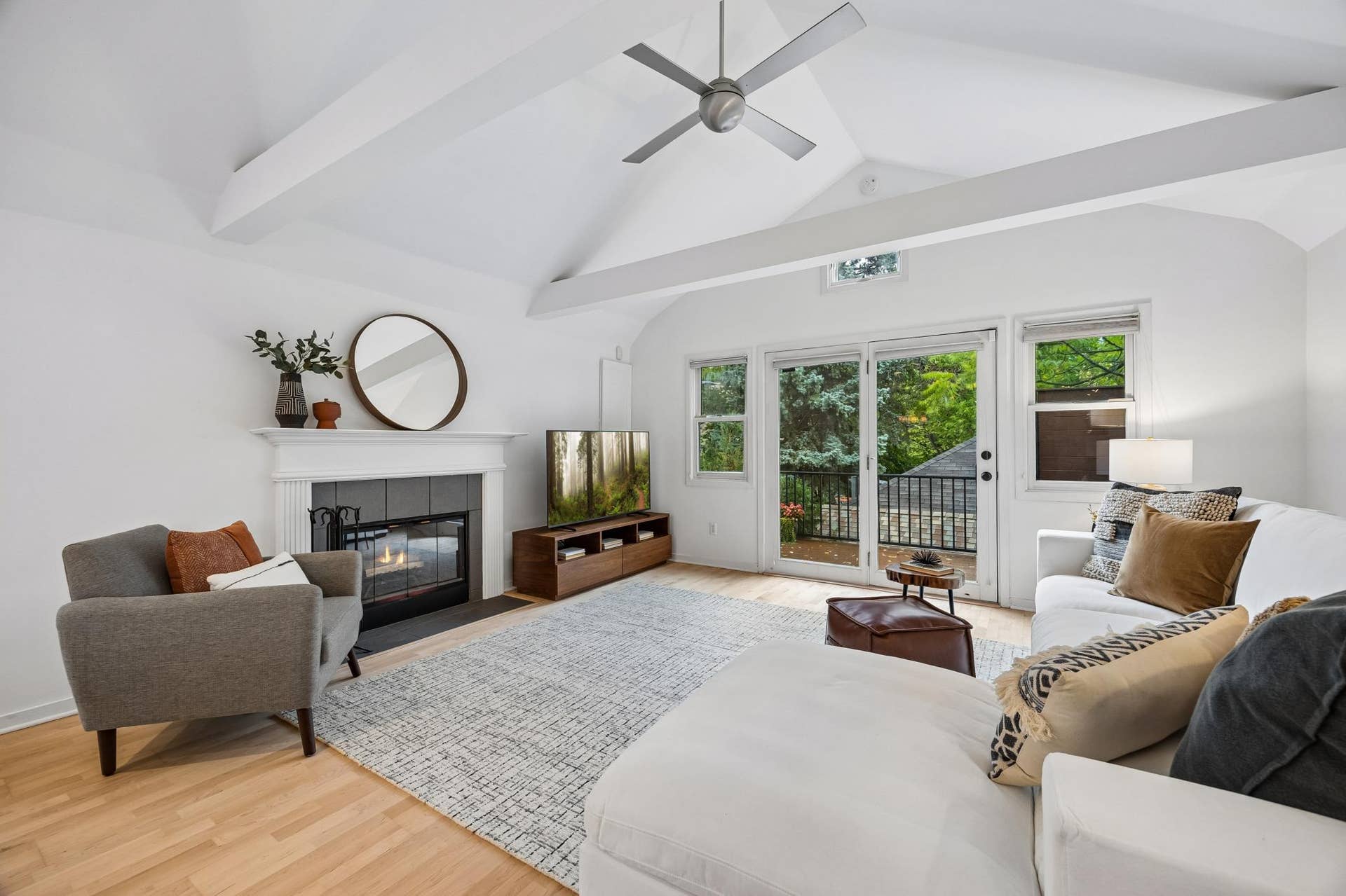 2637 1/2 Humboldt Avenue S, 21, Minneapolis, MN 55408 Bright living room with vaulted ceilings and a gas fireplace creating a warm focal point for the space.