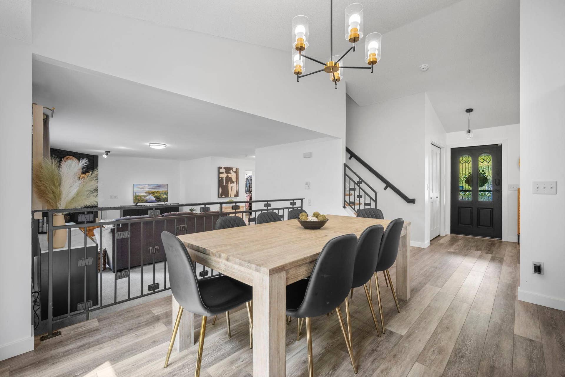 This modified two-story design offers a spacious, open floor plan with excellent flow for both everyday living and entertaining.