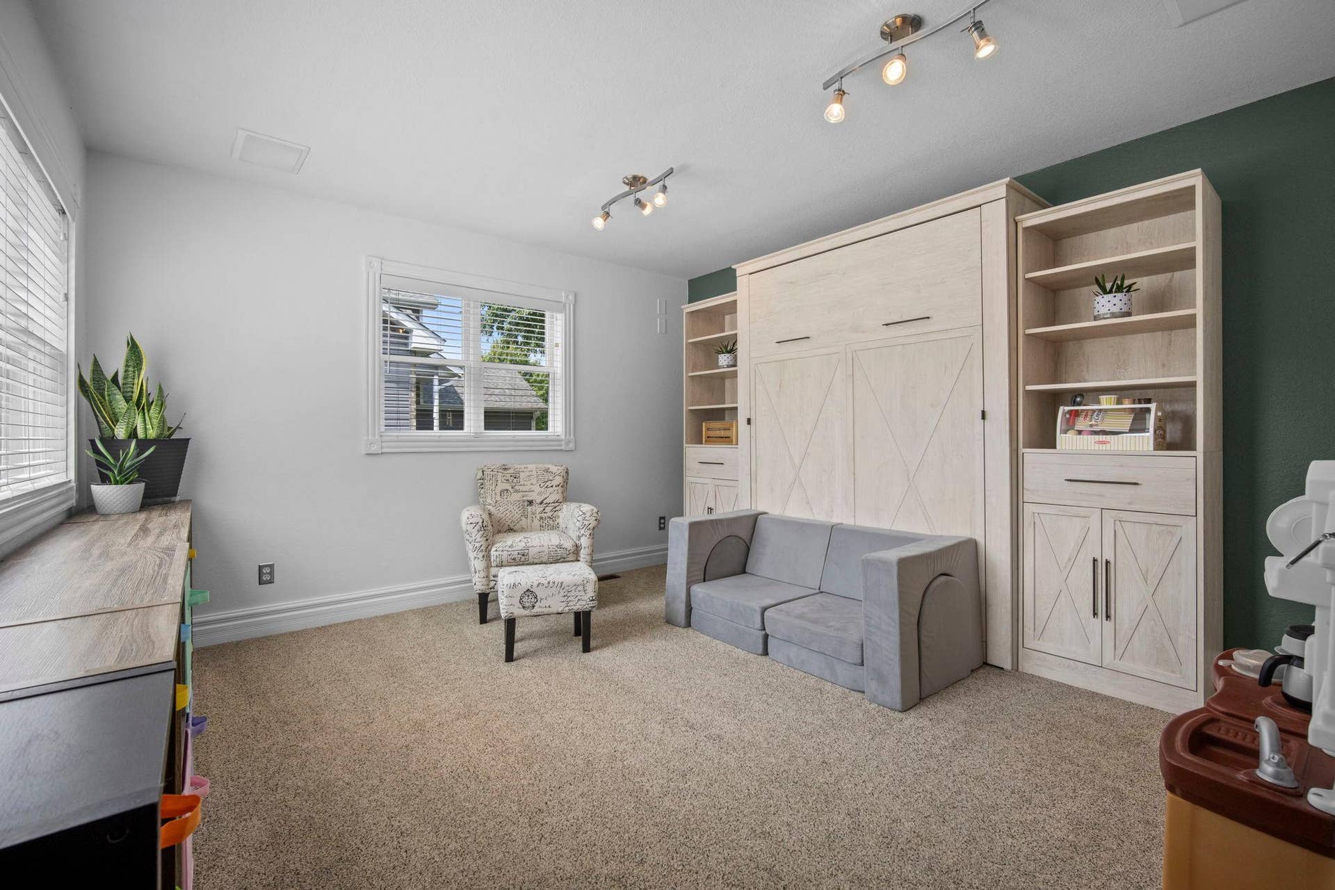 Main level flex room offering double windows that bring in a ton of natural light. Incredible flex space or future 5th bedroom.