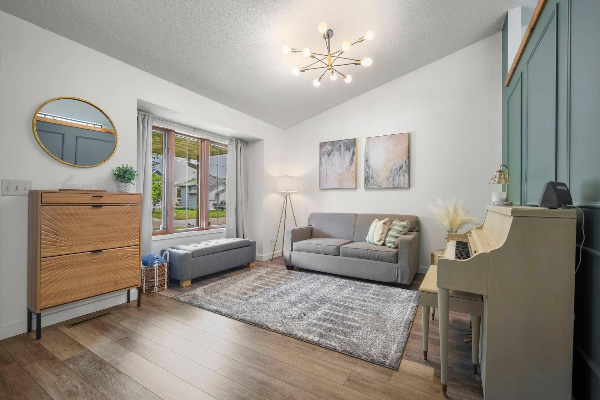 Modern, neutral finishes throughout complement the vaulted main-level living room, creating a bright and welcoming open floor plan.