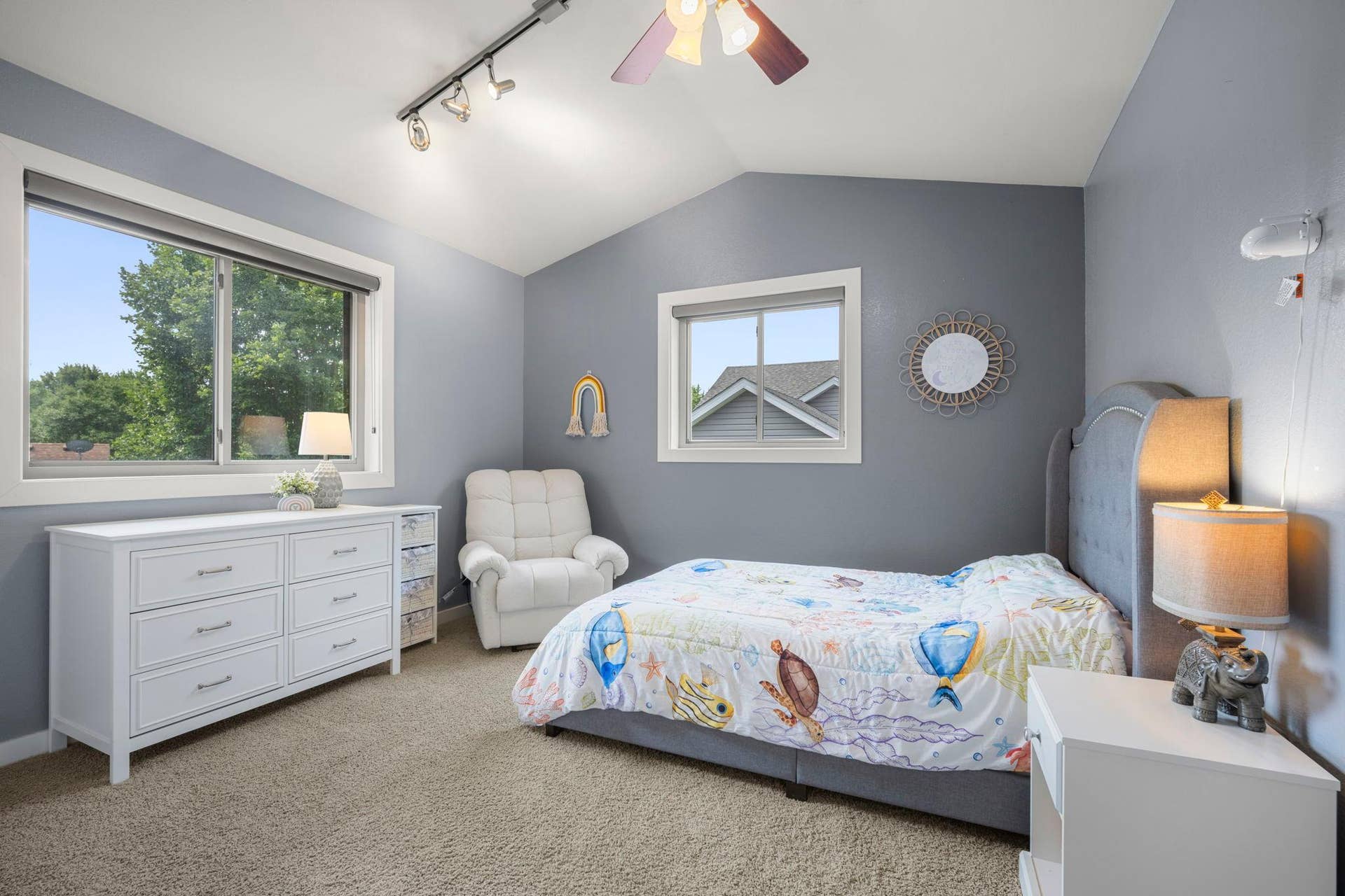 2nd bedroom updates features vaulted ceilings.