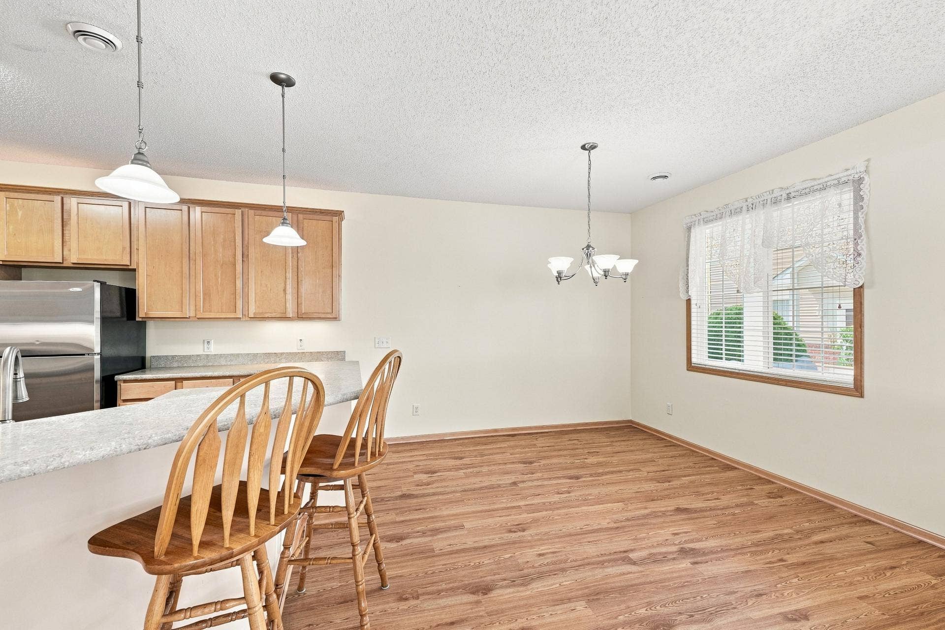 11021 Oak Grove Circle #C, Woodbury, MN 55129 Dining with Laminate Flooring