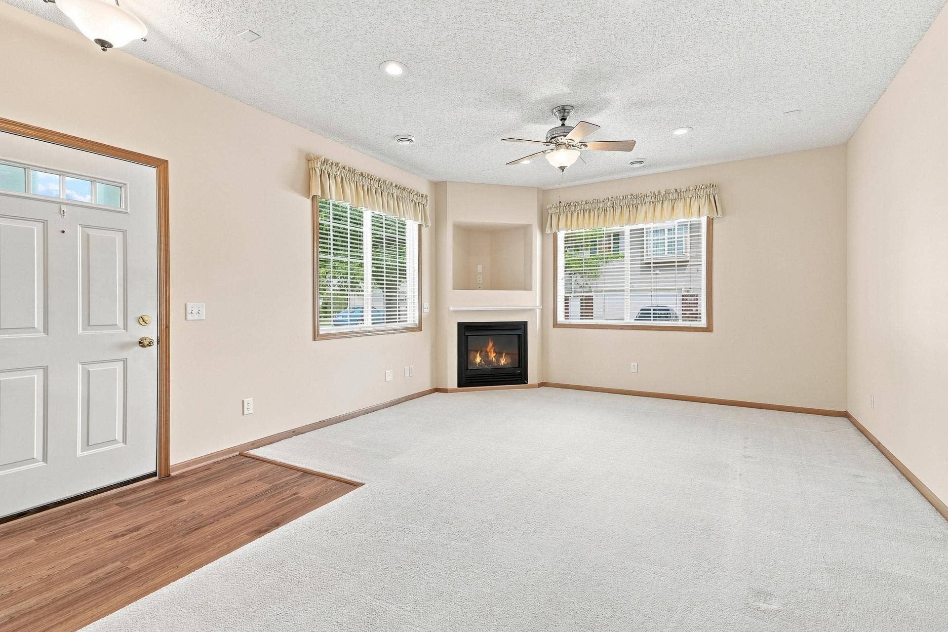 11021 Oak Grove Circle #C, Woodbury, MN 55129 Bright Living Room with Gas Fireplace and Ceiling Fan