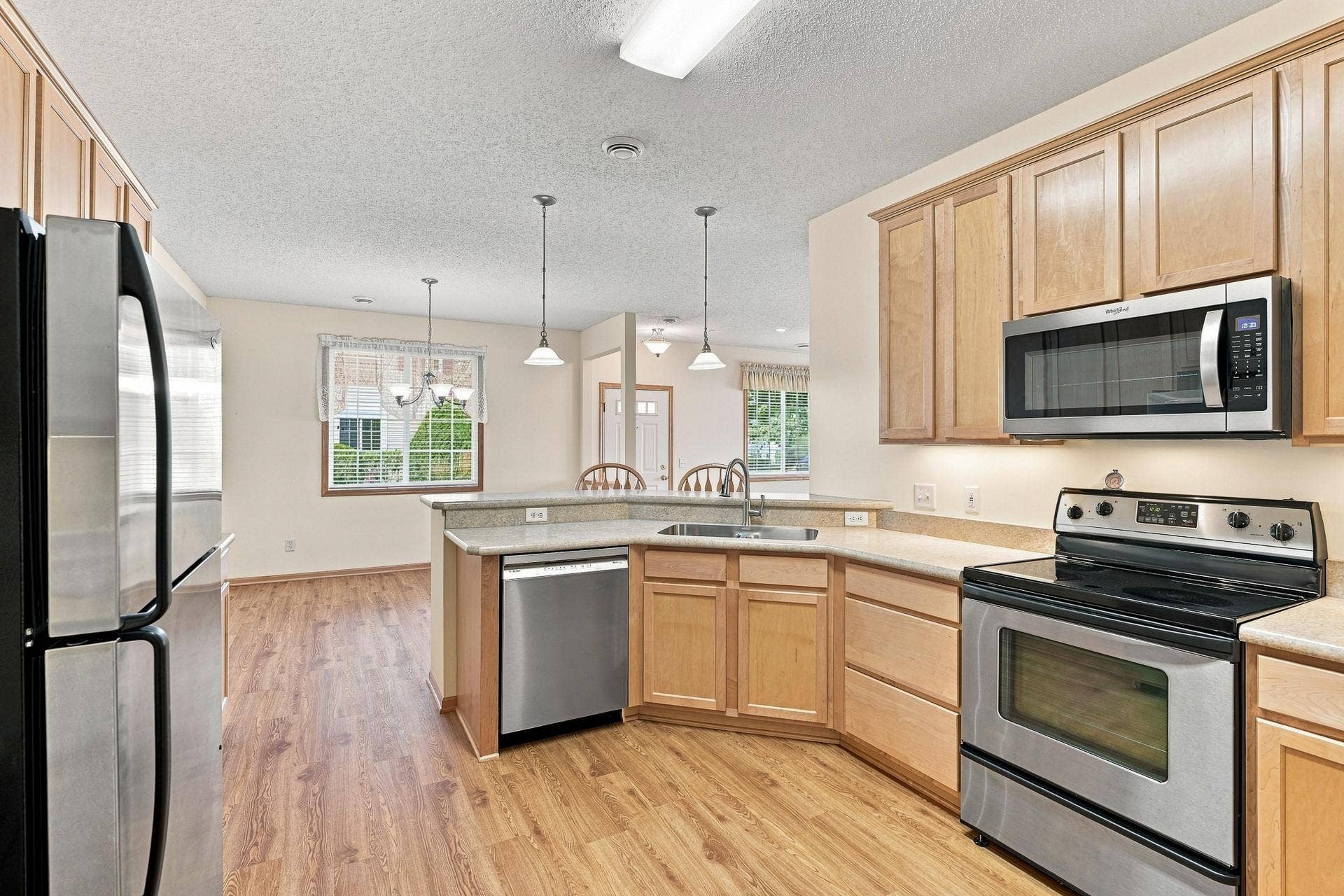 11021 Oak Grove Circle #C, Woodbury, MN 55129 Maple Cabinets, SS Appliances, Pending Lighting & Over-the-Counter Lighting