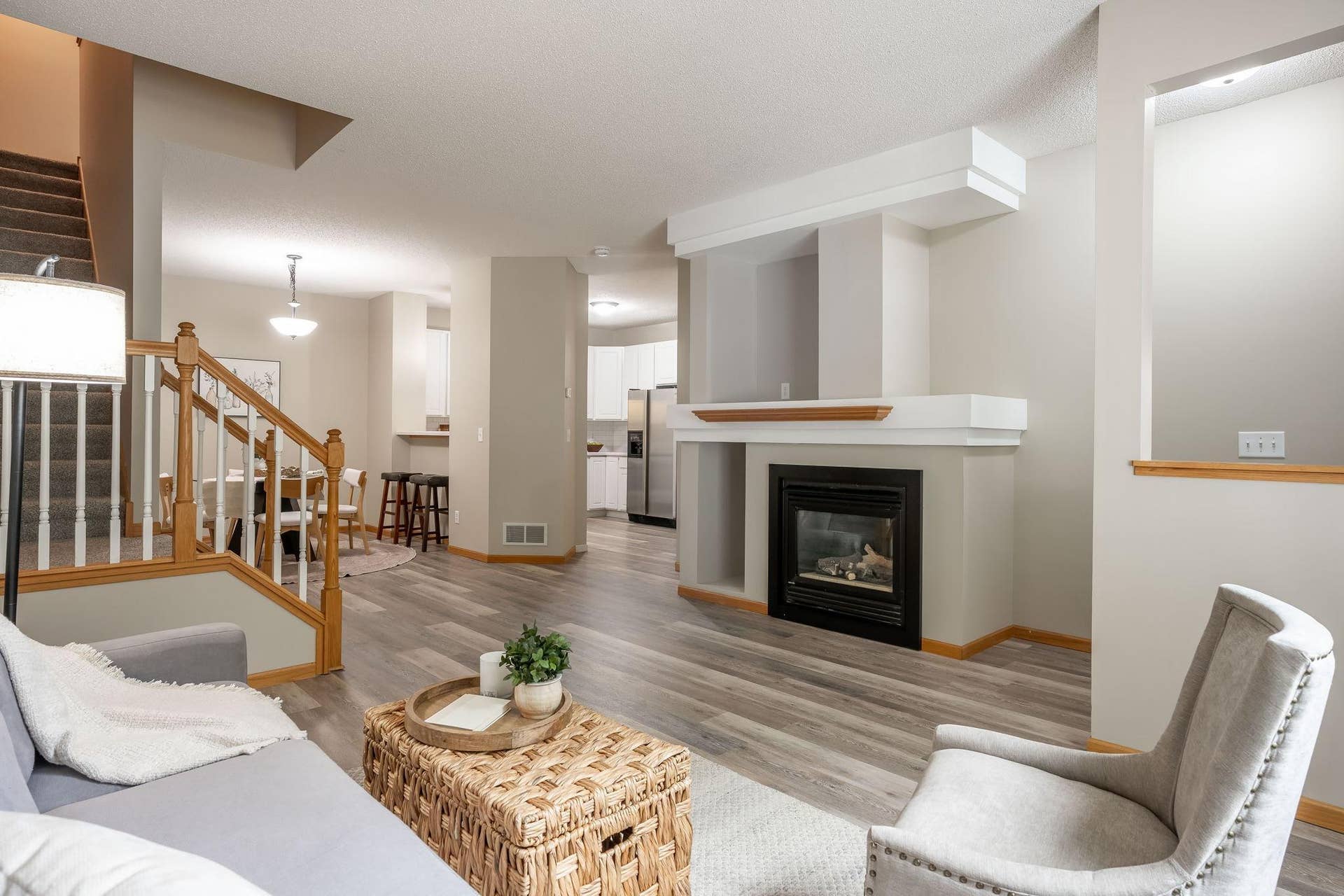 3001 Juniper Lane, #I, Woodbury, MN 55125 Open-concept main level offering a seamless flow between the family room, dining area, and kitchenperfect for everyday living and entertaining